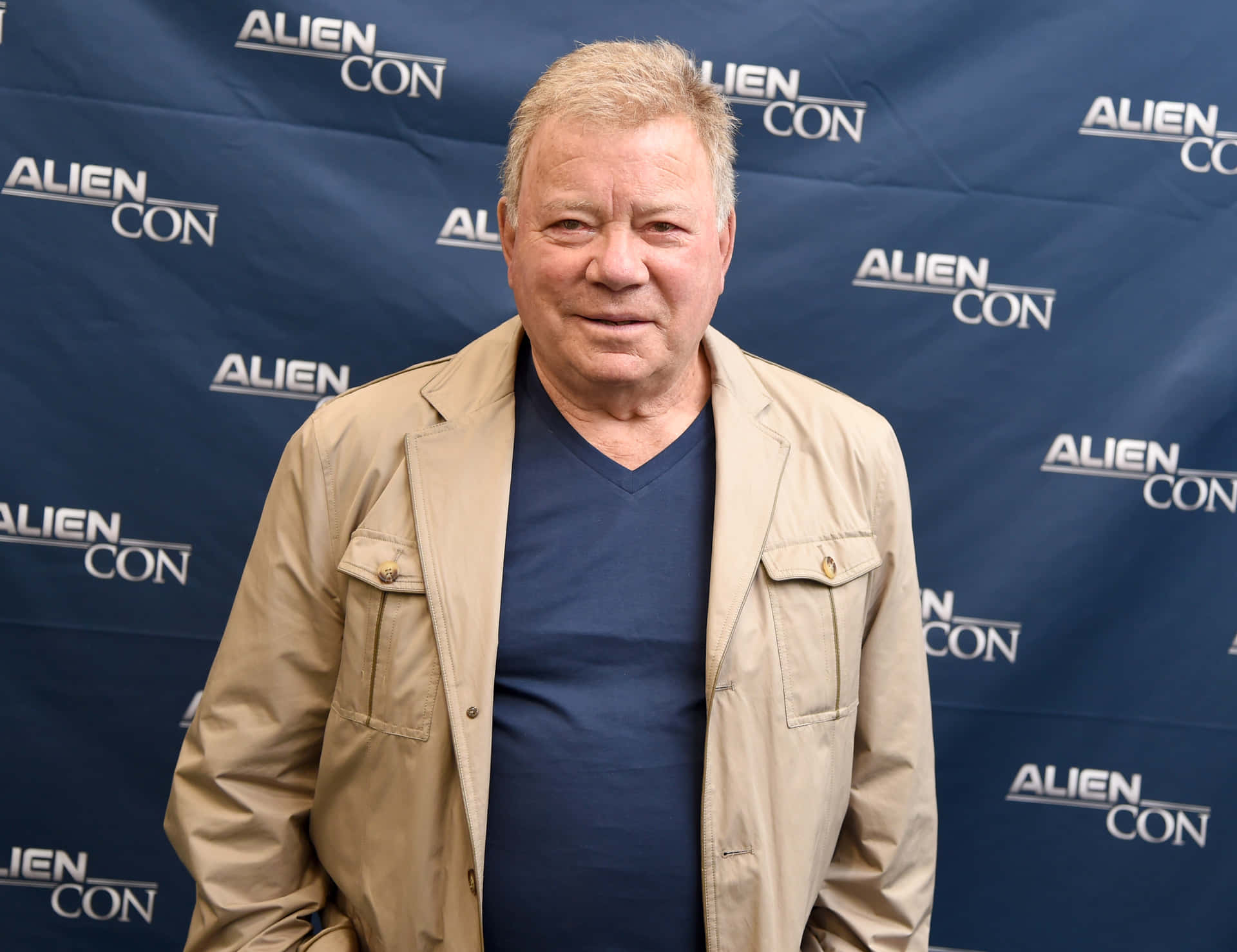 Legendary William Shatner Striking A Classic Pose Background