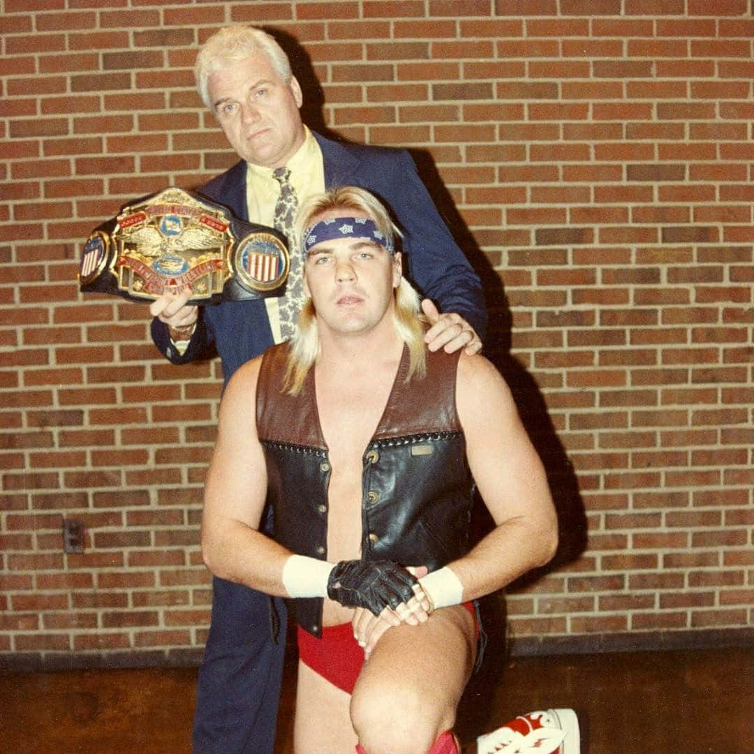 Legendary Wrestler Barry Windham Against Brick Wall Background