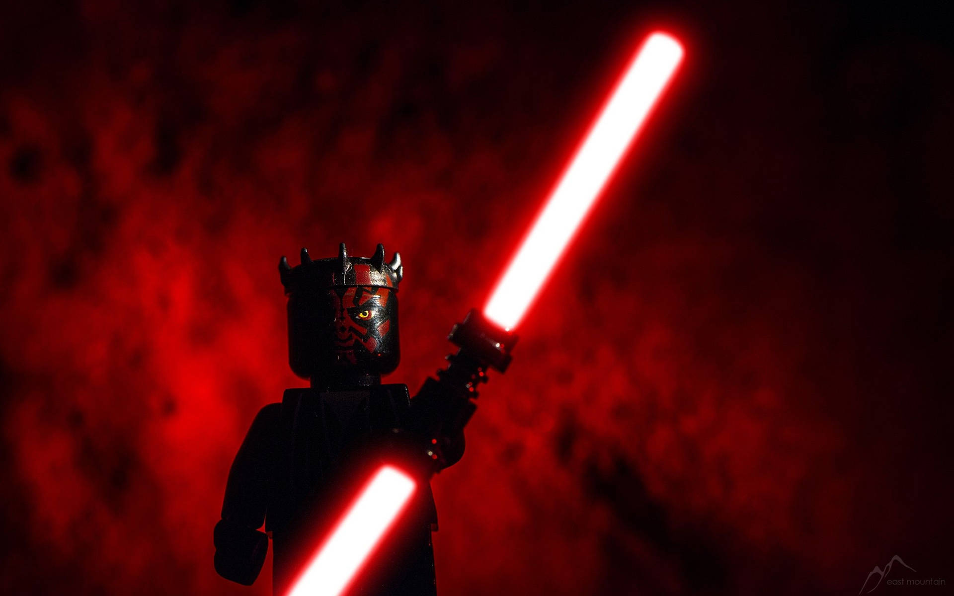 Lego Darth Maul Holds A Double-bladed Lightsaber Background