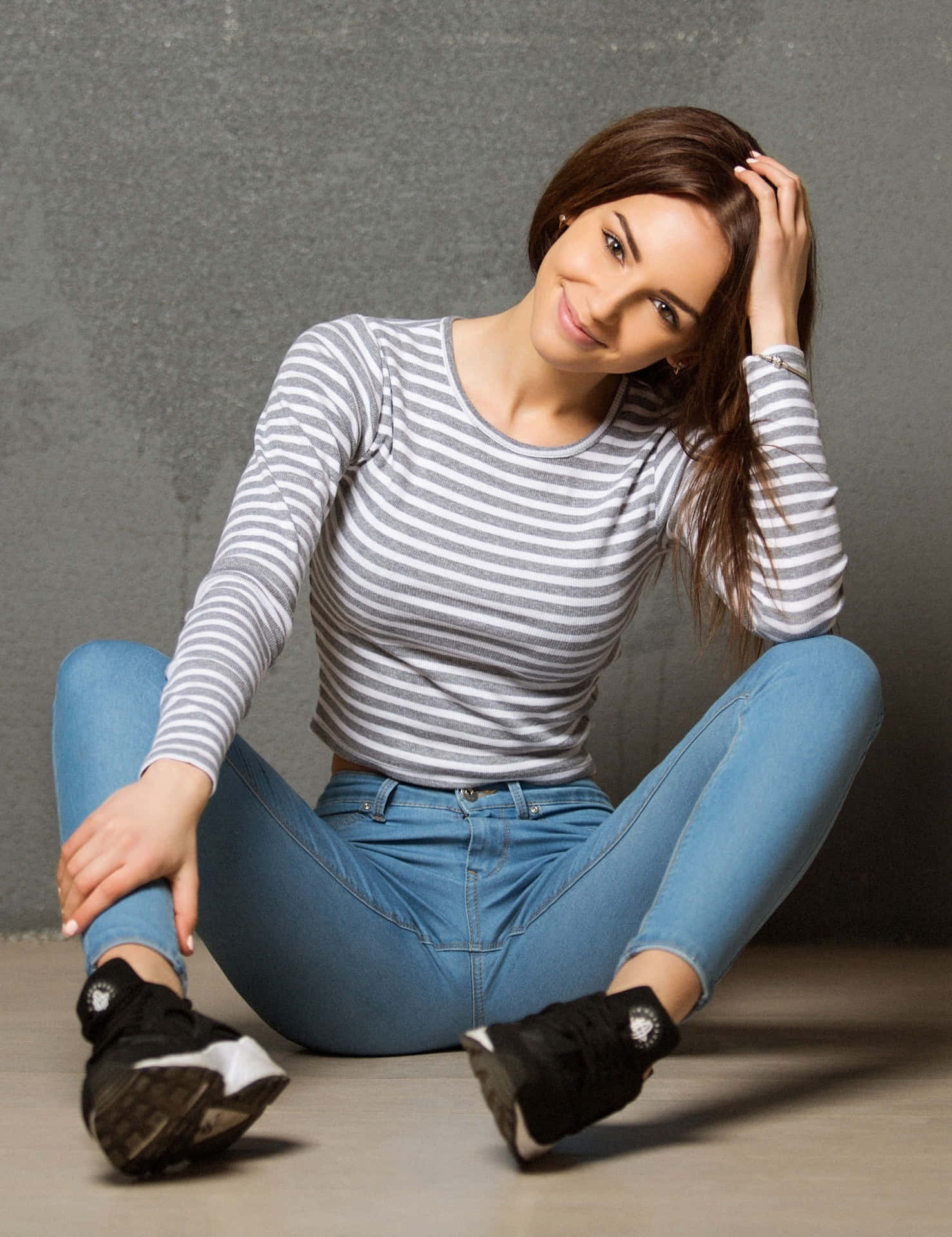 Legs Spread In Blue Jeans Background