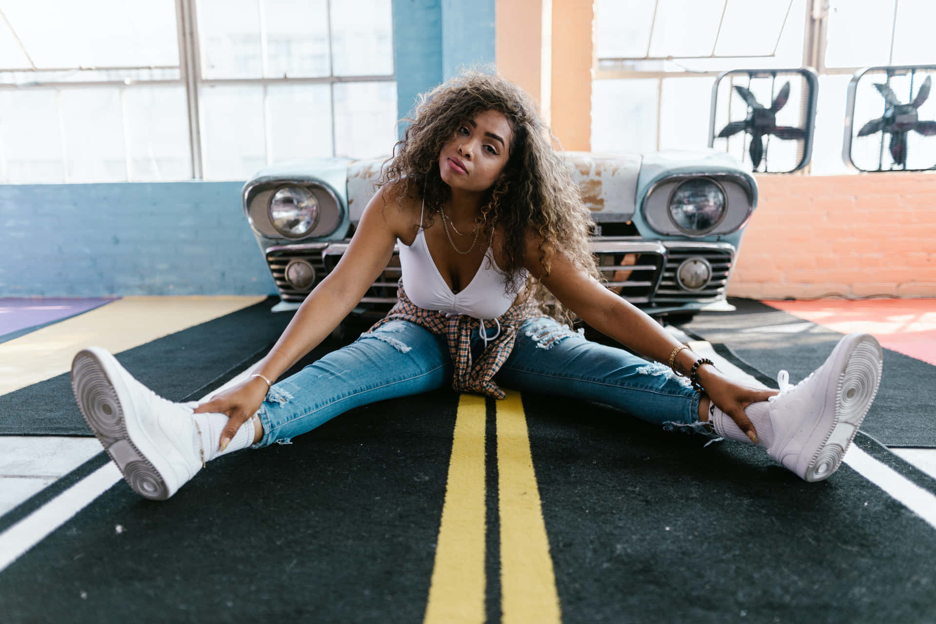 Legs Spread In White Sneakers Background