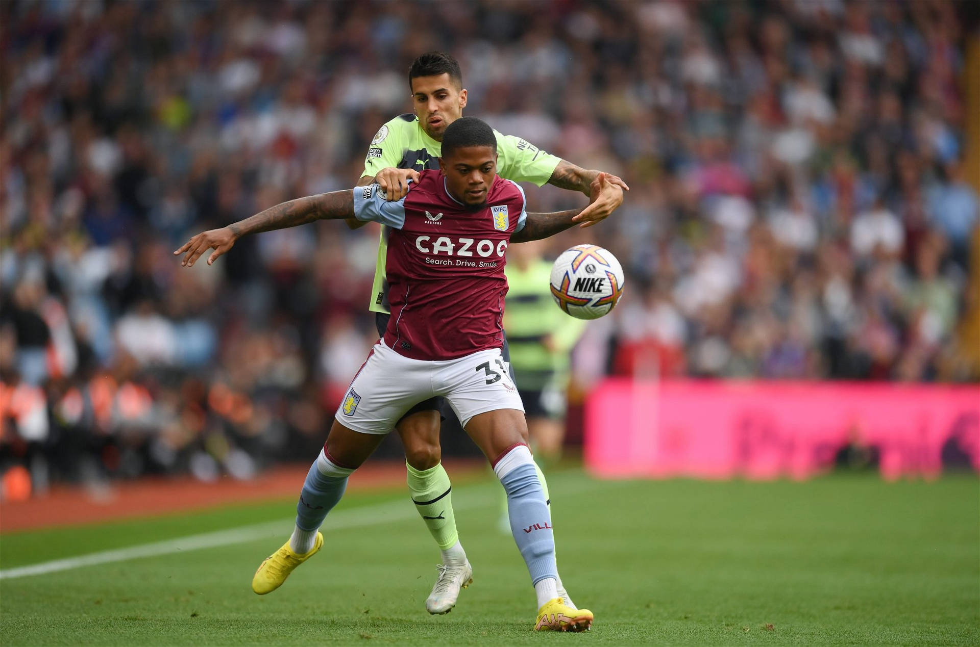 Leon Bailey Being Held By Opponent