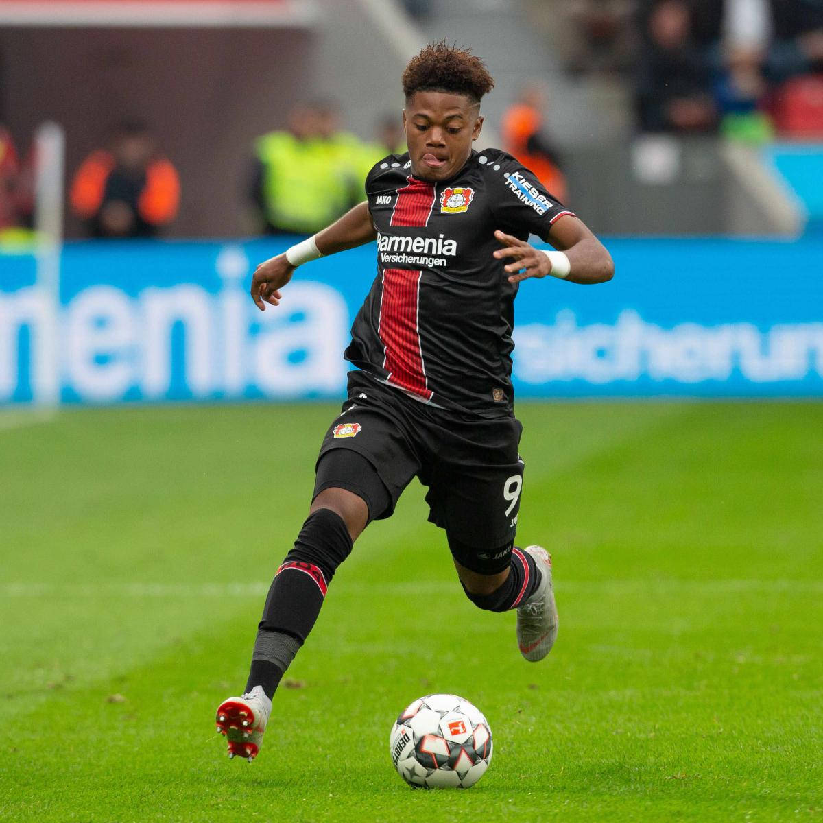 Leon Bailey Leverkusen Running Ball Background