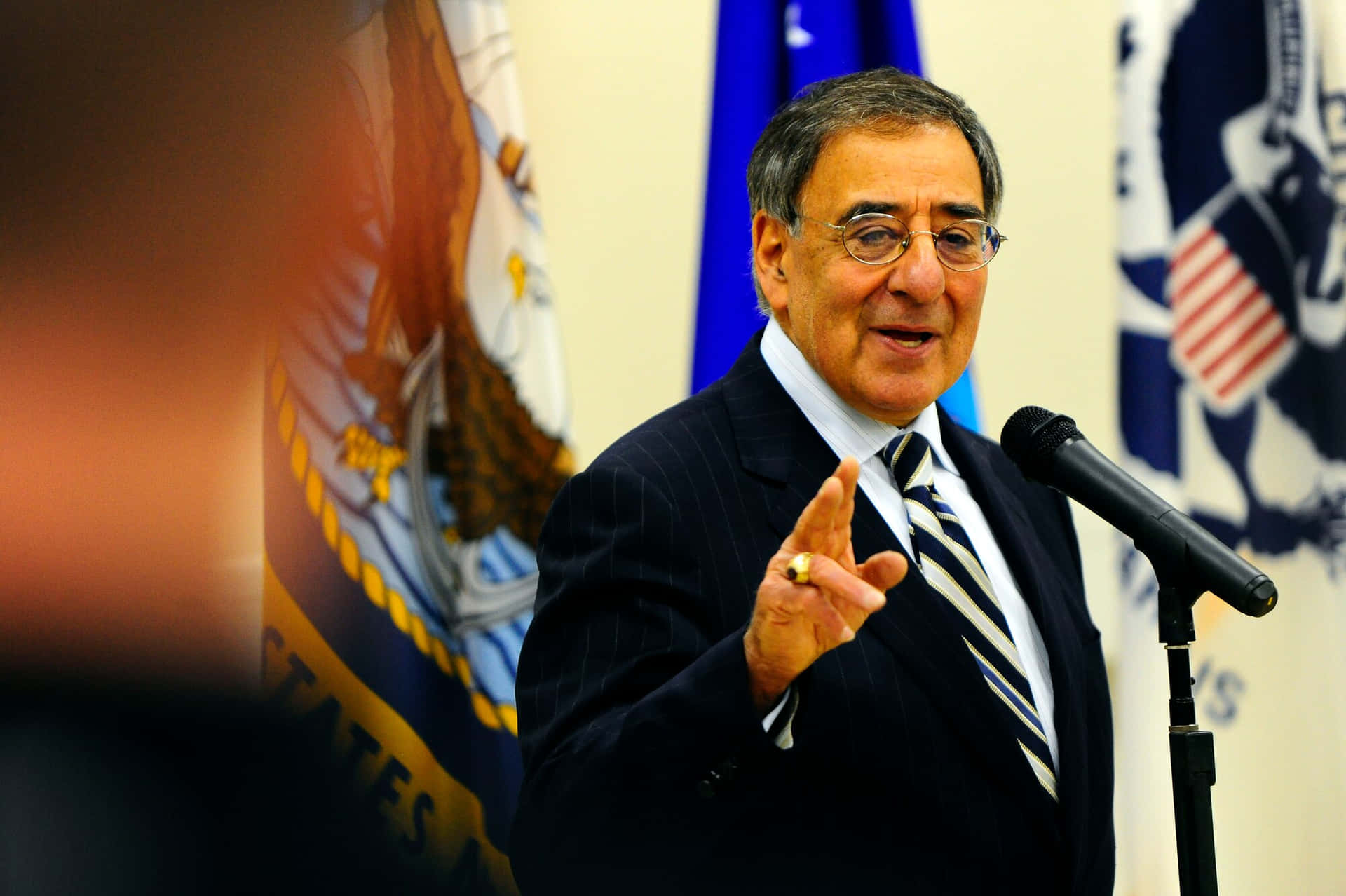Leon Panetta Doing Hand Gesture Background