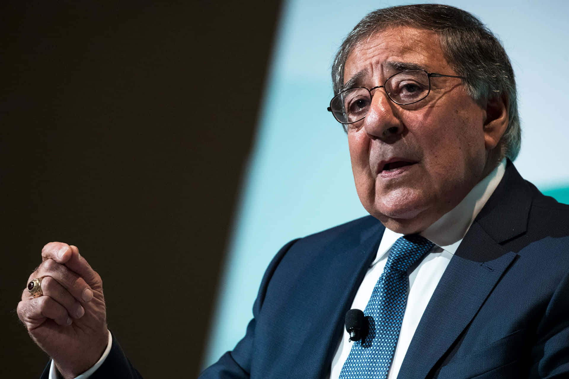Leon Panetta Talking With Hand Gesture Background
