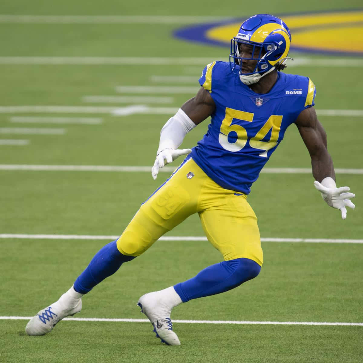 Leonard Floyd Blue And Yellow Football Kit Background