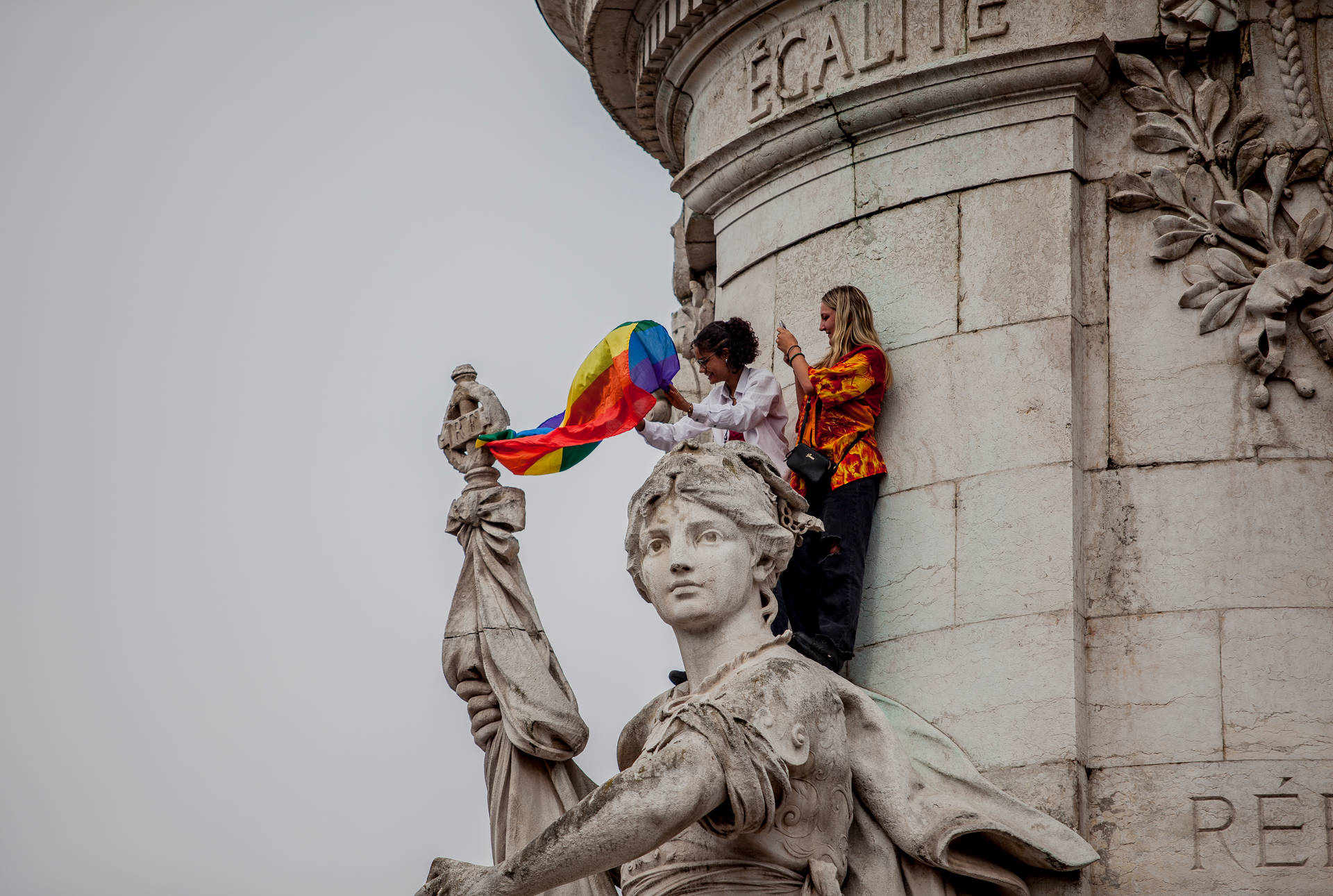 Lesbian Carrying Rainbow Flag Background