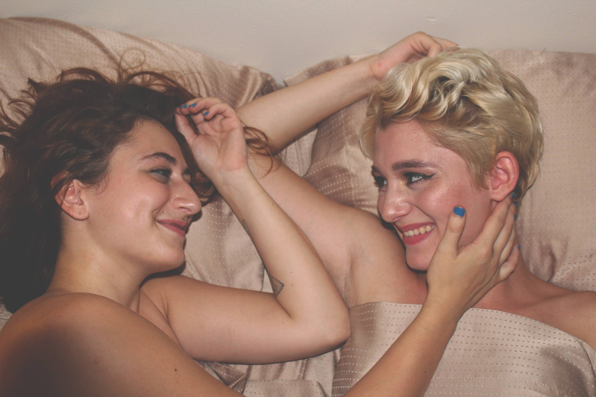 Lesbian Couple On Bed Background