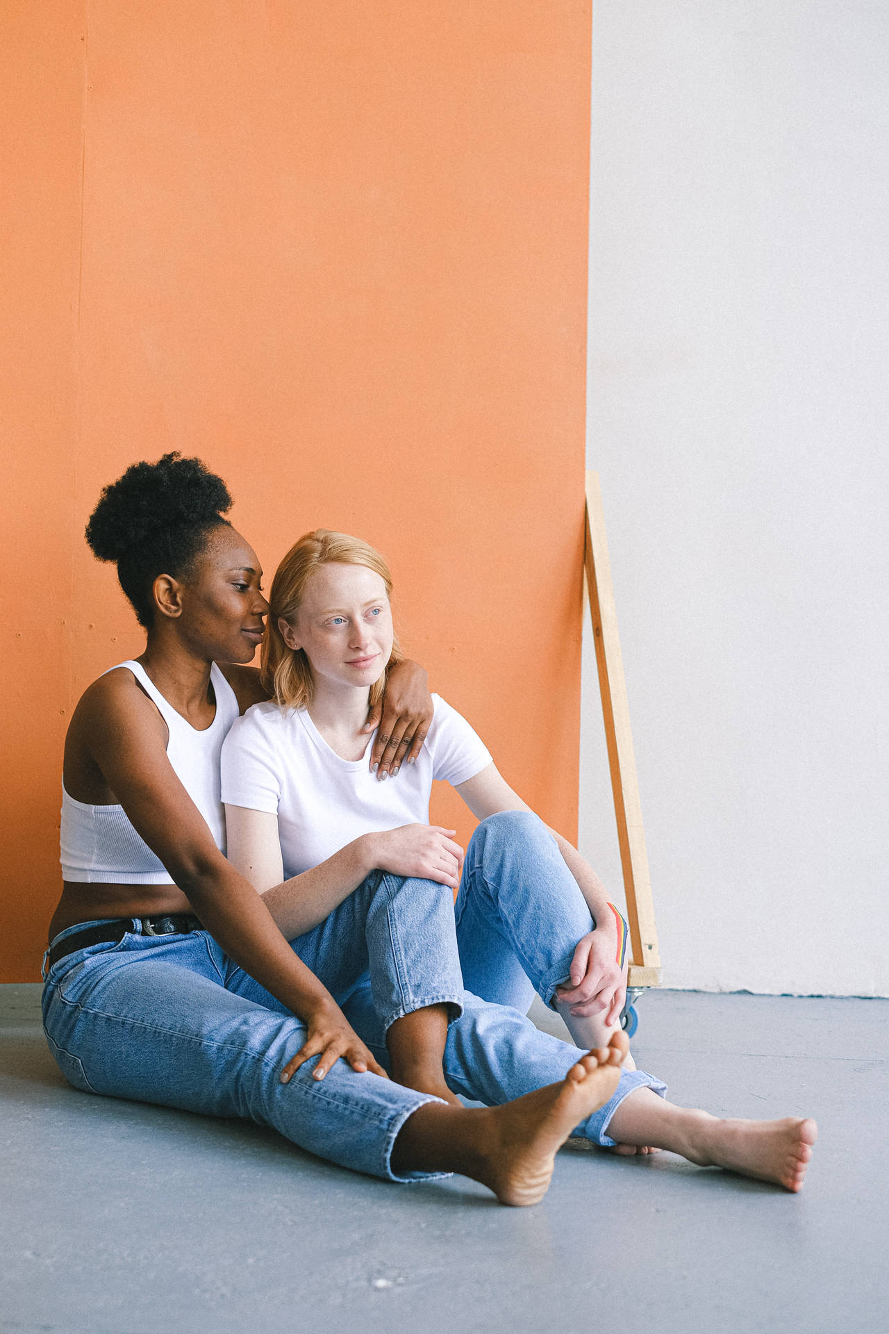 Lesbian Girl Sitting On Floor Background