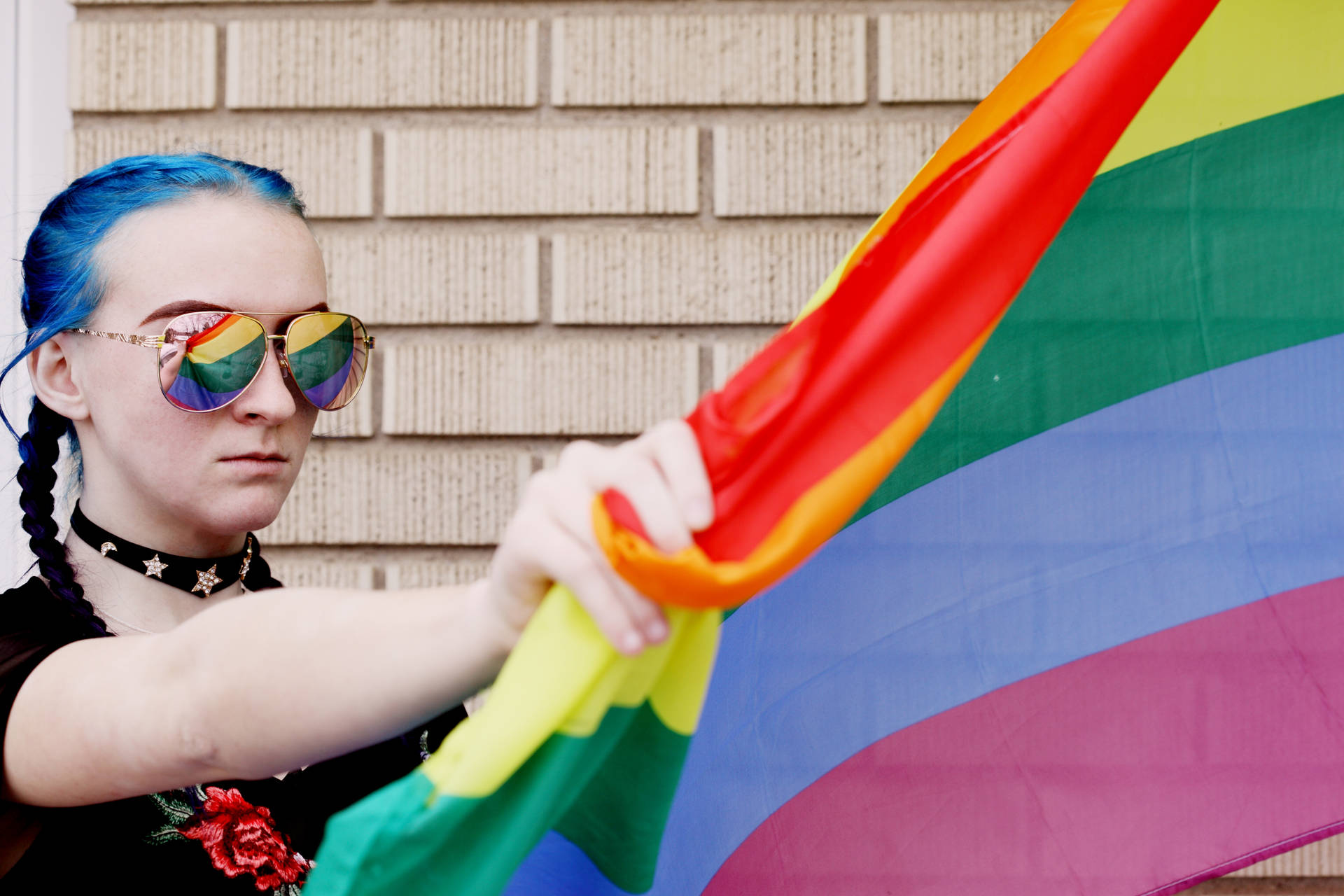 Lesbian Holding Lgbt Flag Background