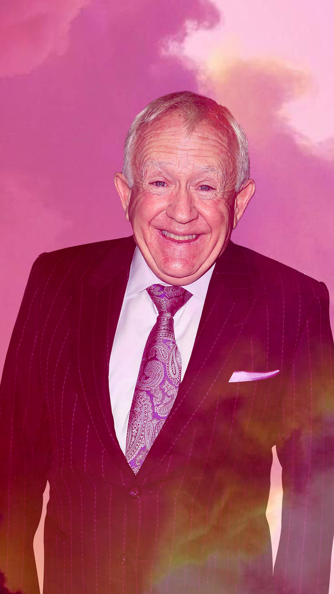 Leslie Jordan In Suit Smiling Background