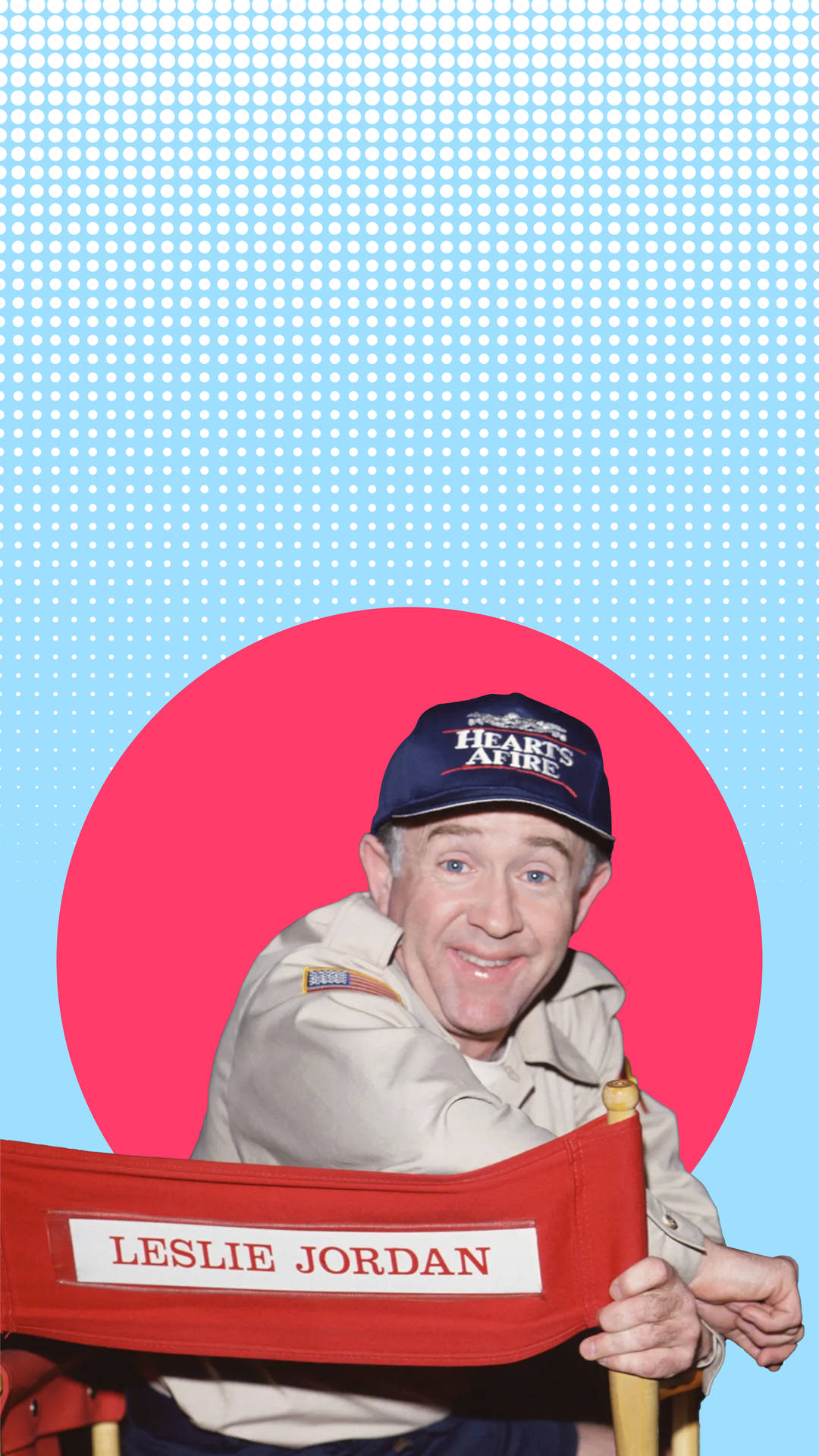 Leslie Jordan Posing In A Red Circle With A Vibrant Blue Background. Background