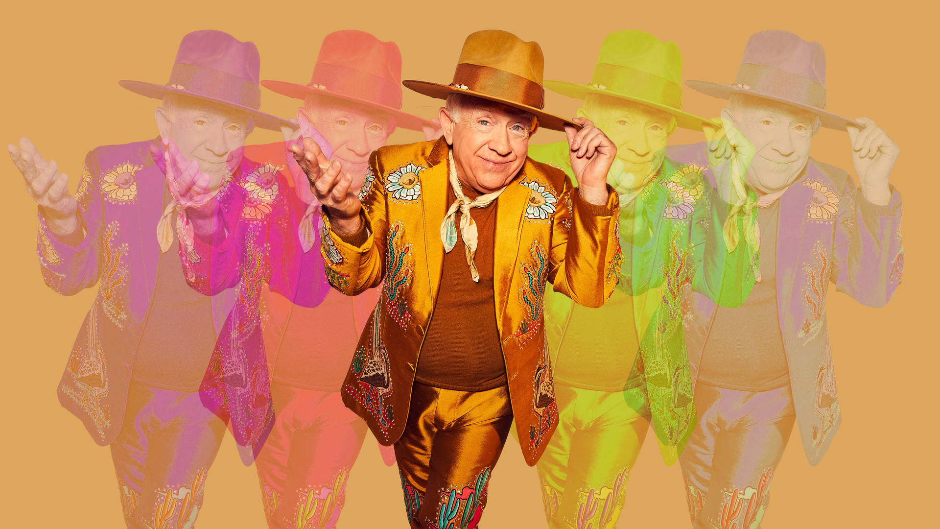 Leslie Jordan - Radiant In Rainbow Hat Background