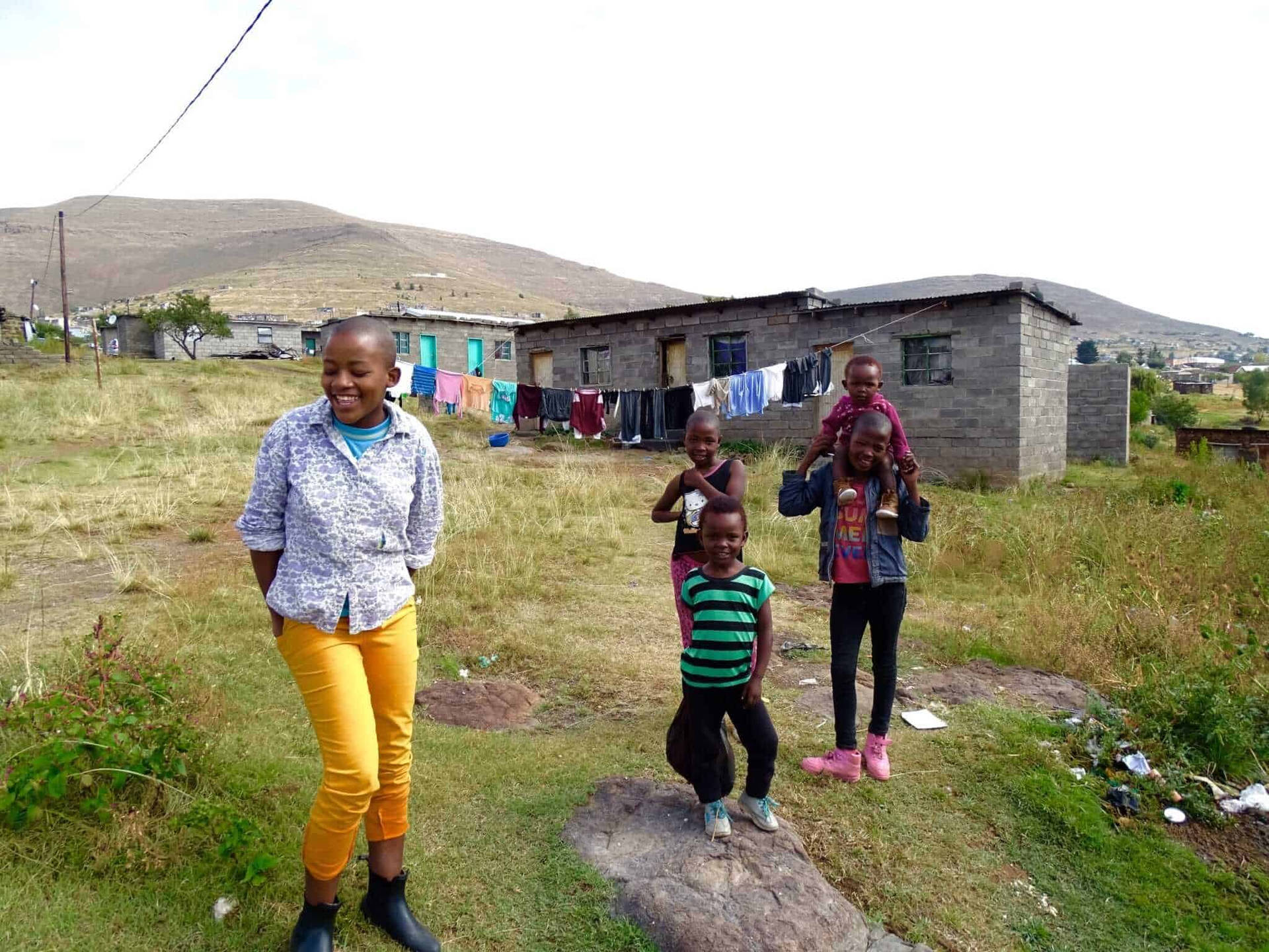 Lesotho Kids Playing Outside House Background