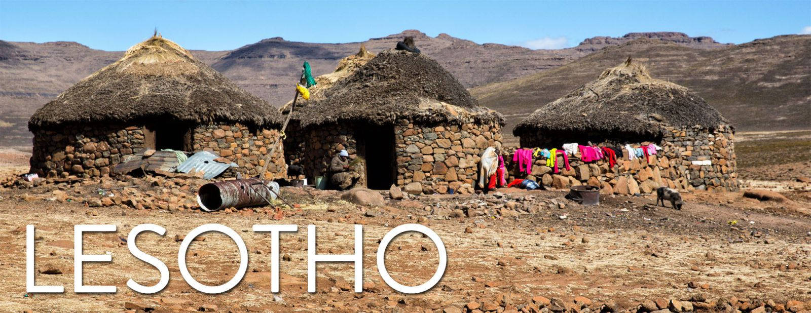 Lesotho Three Brick Houses Background