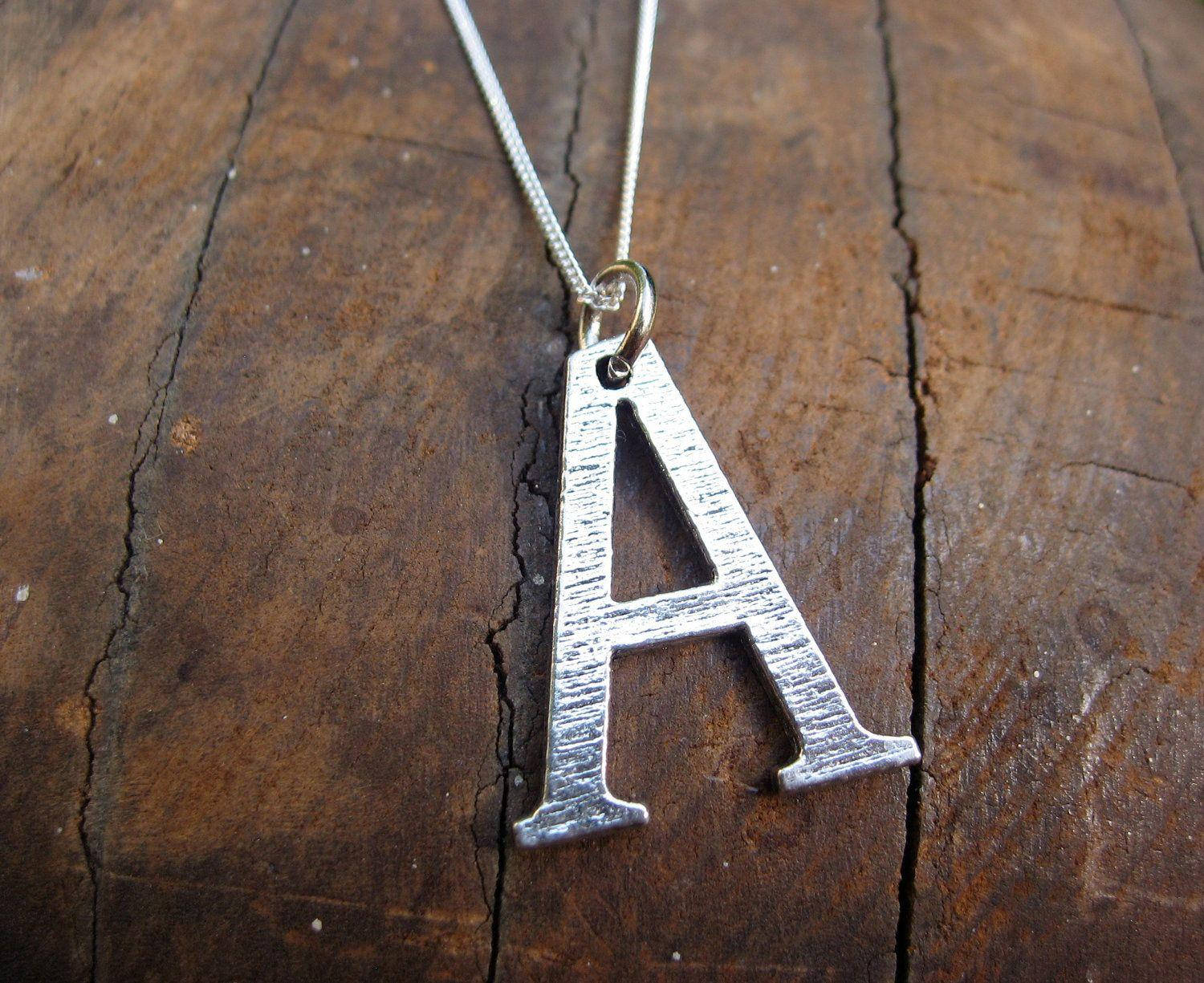 Letter A Pendant On Wood