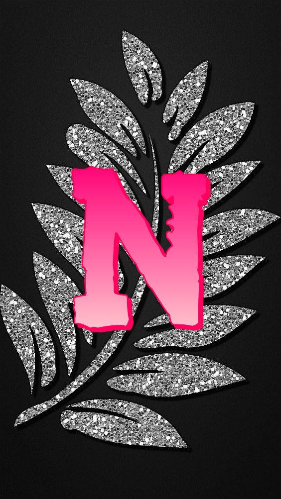 Letter N With Silver Glitter Leaves Background