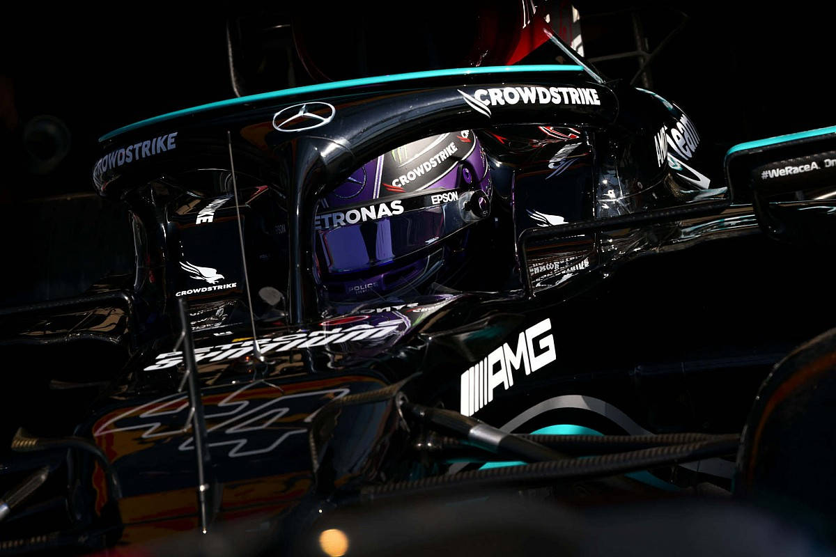 Lewis Hamilton Inside Black Mercedes Background