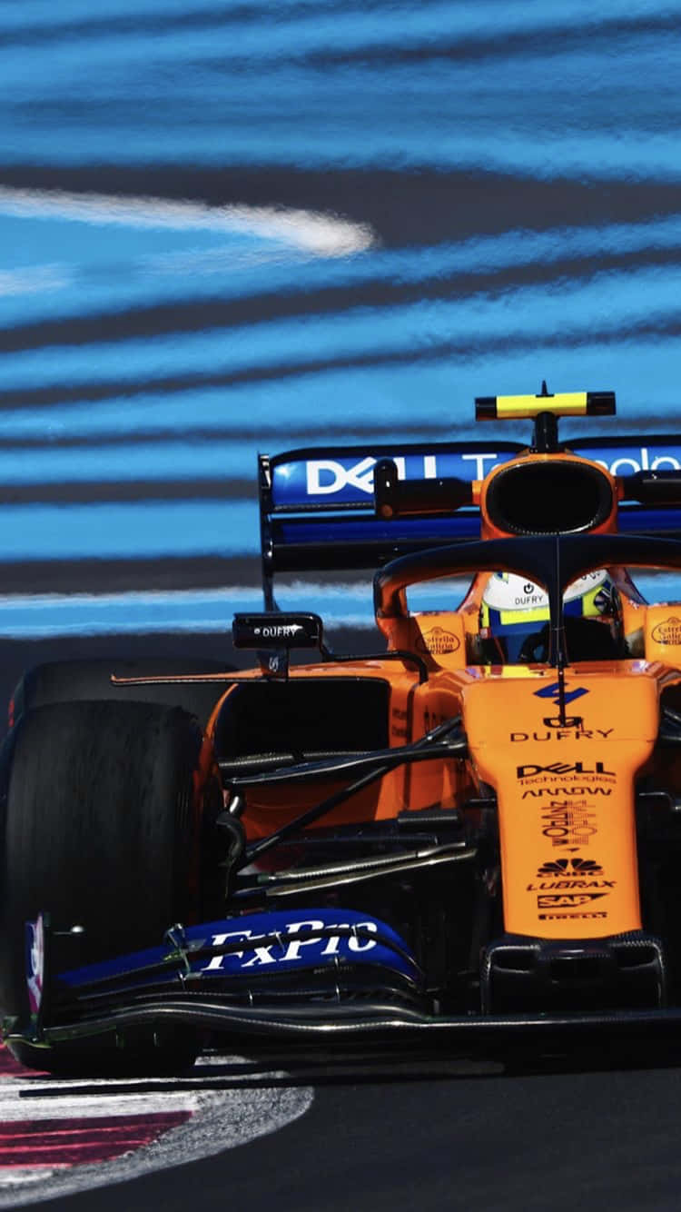 Lewis Hamilton On The Track In A Mclaren Formula 1 Racecar Background