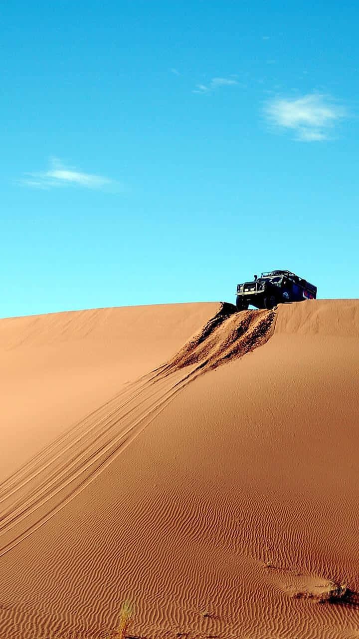 Lg G4 Jeep Over A Sand Dune Background