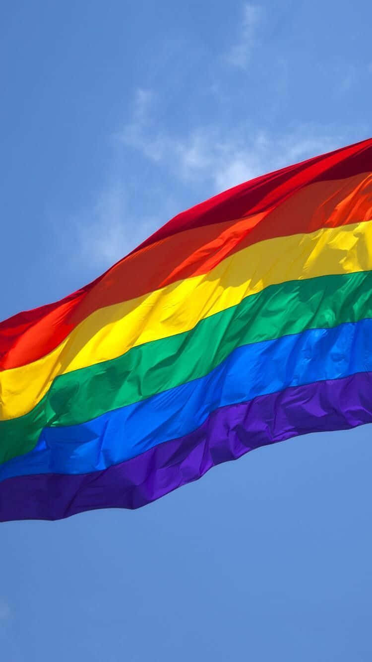 Lgbt Flag Over The Blue Sky Iphone Background