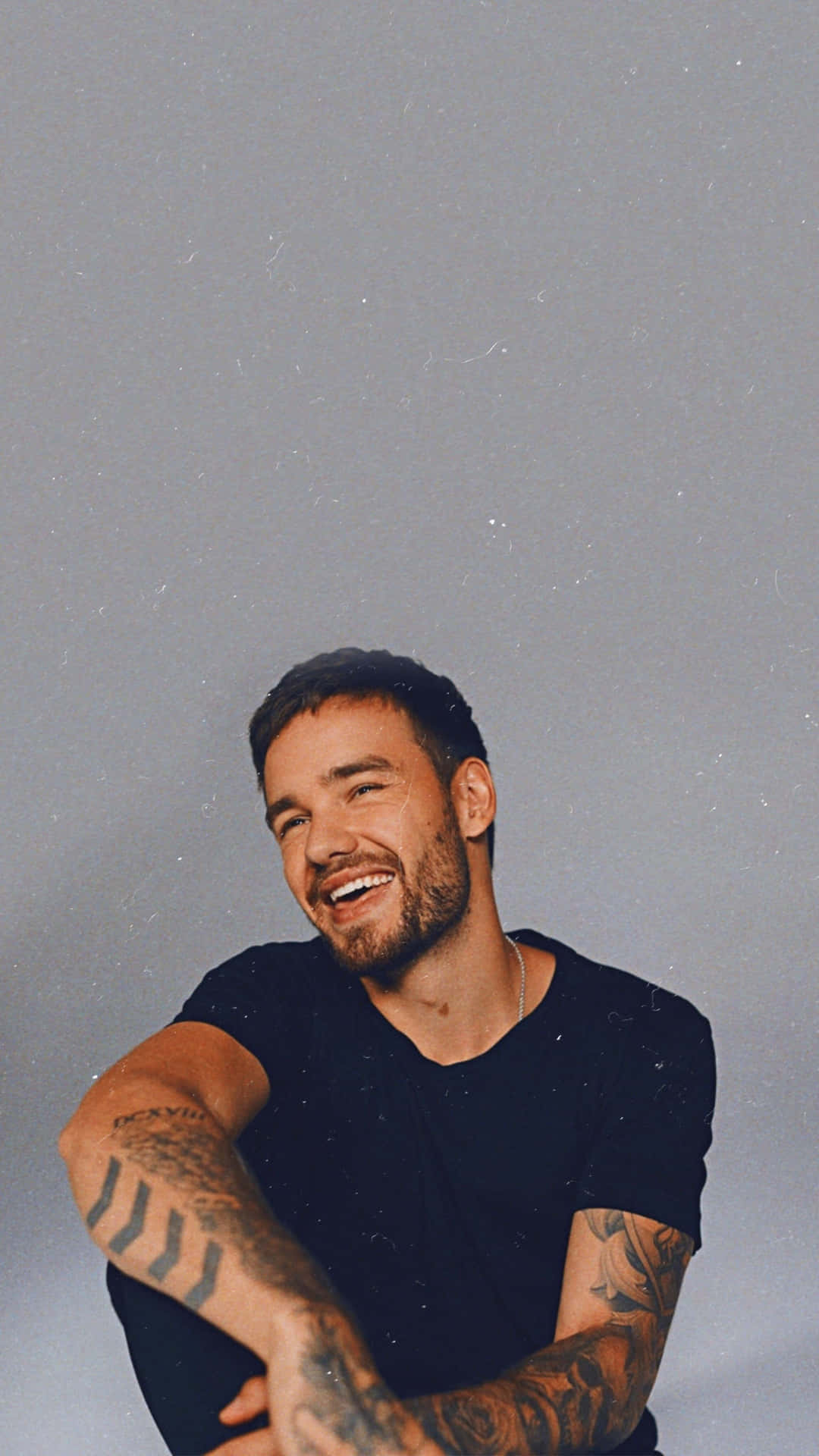 Liam Payne Having Fun On The Beach Background