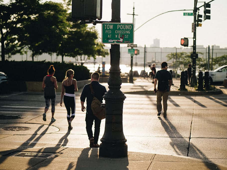 Life In Motion - Unidentified People Walking On A Scenic Towpath Background