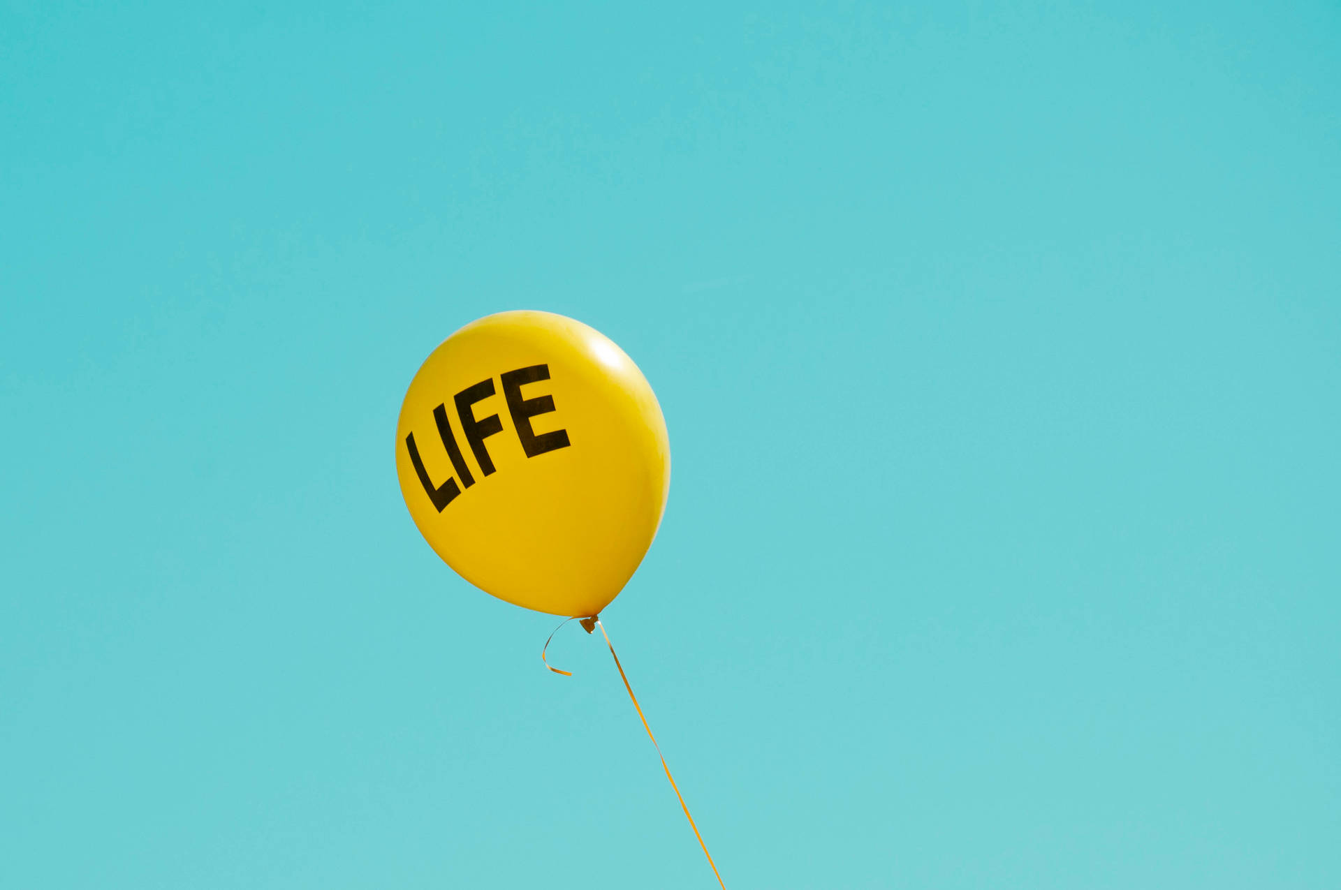 Life Word In Yellow Balloon Background