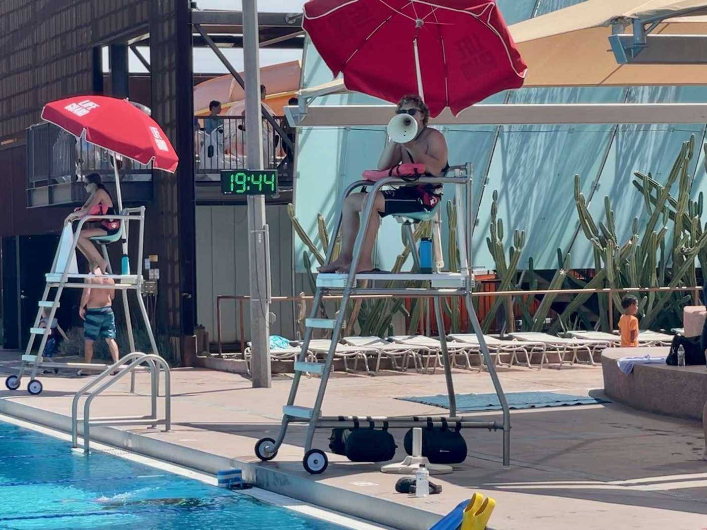 Lifeguard On Guard At Poolside Background