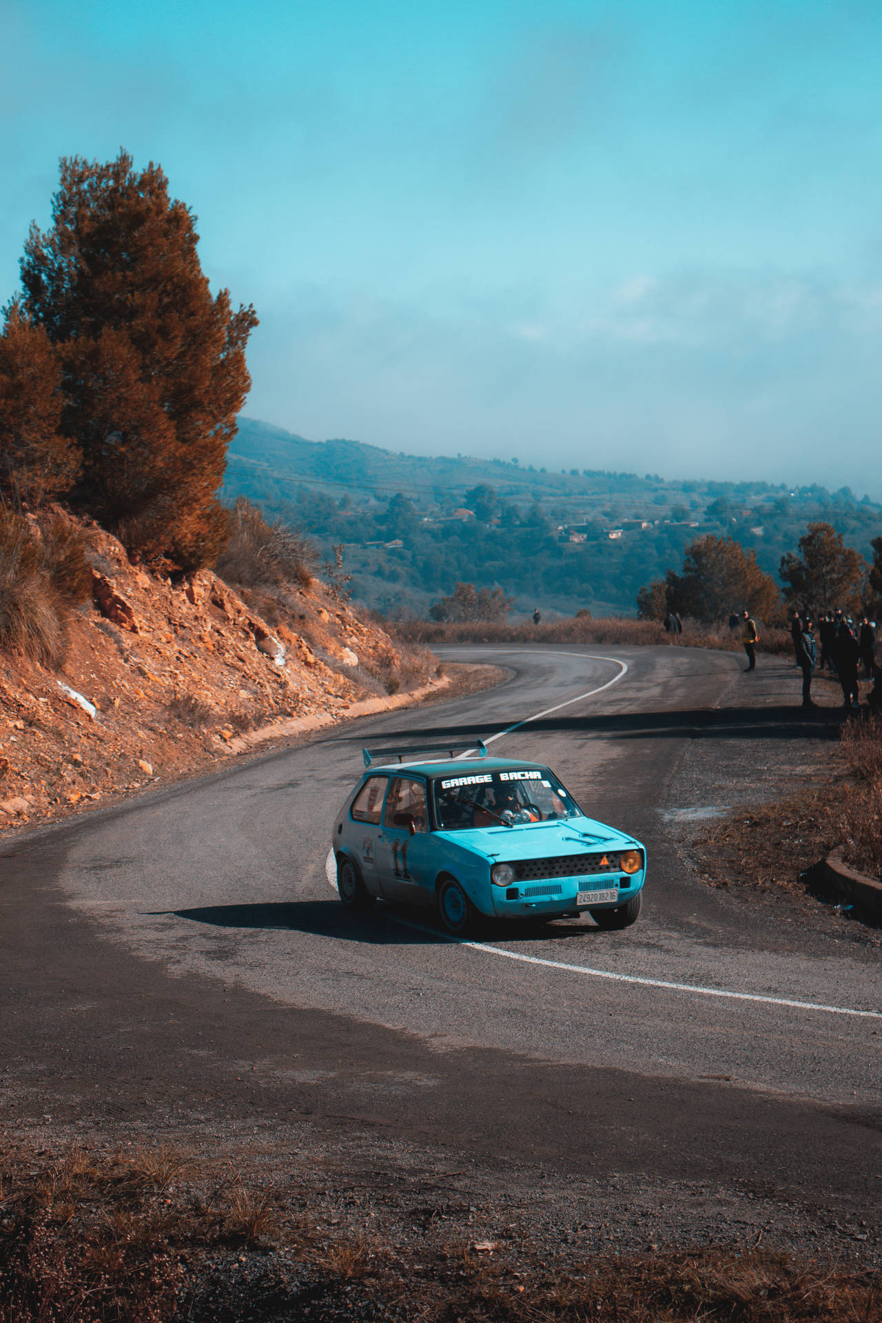 Light Blue Car Racing In Dirt Rally Games