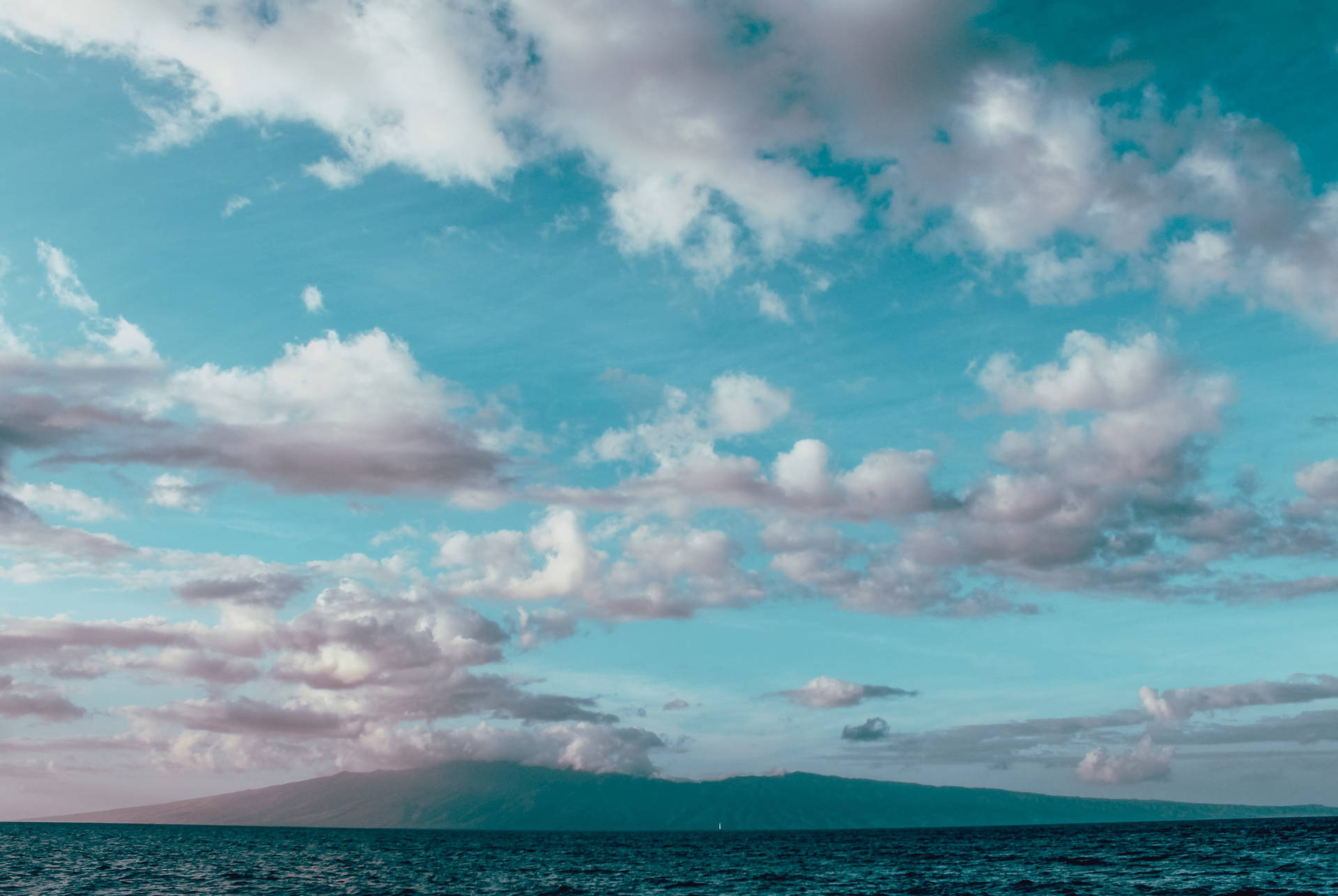 Light Blue Ocean With Cloudy Sky