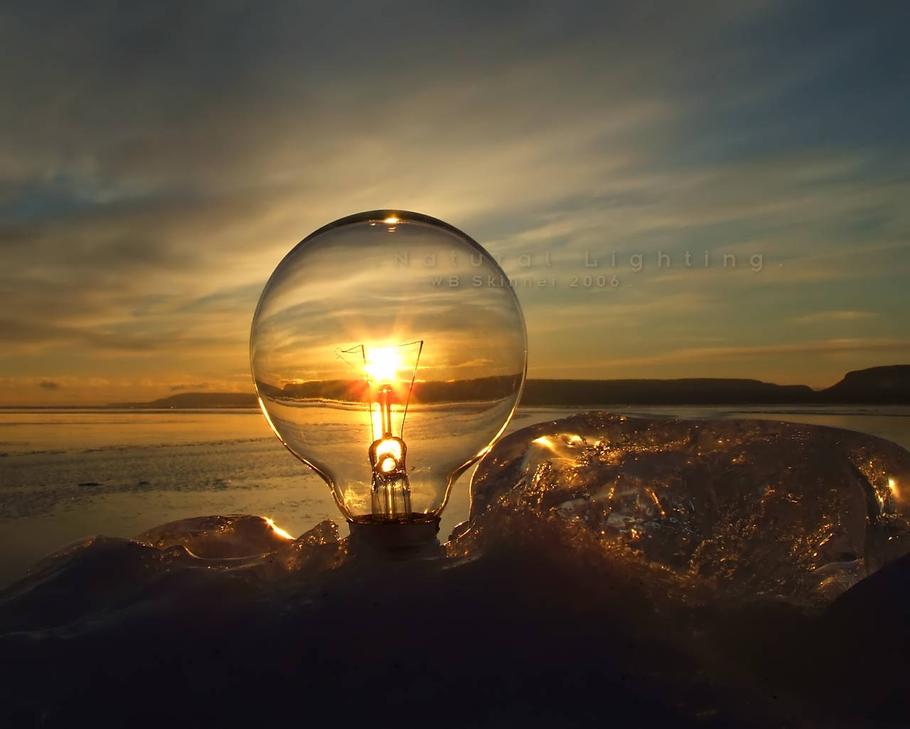 Light Bulb On A Sunset Background