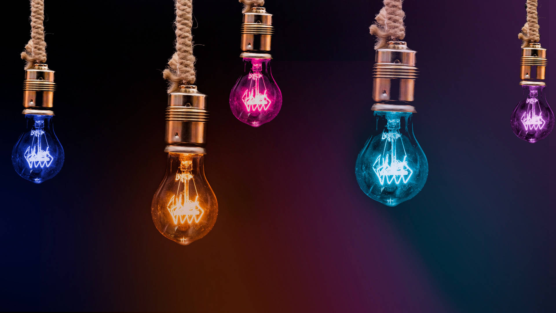 Light Bulbs In Different Colors Background