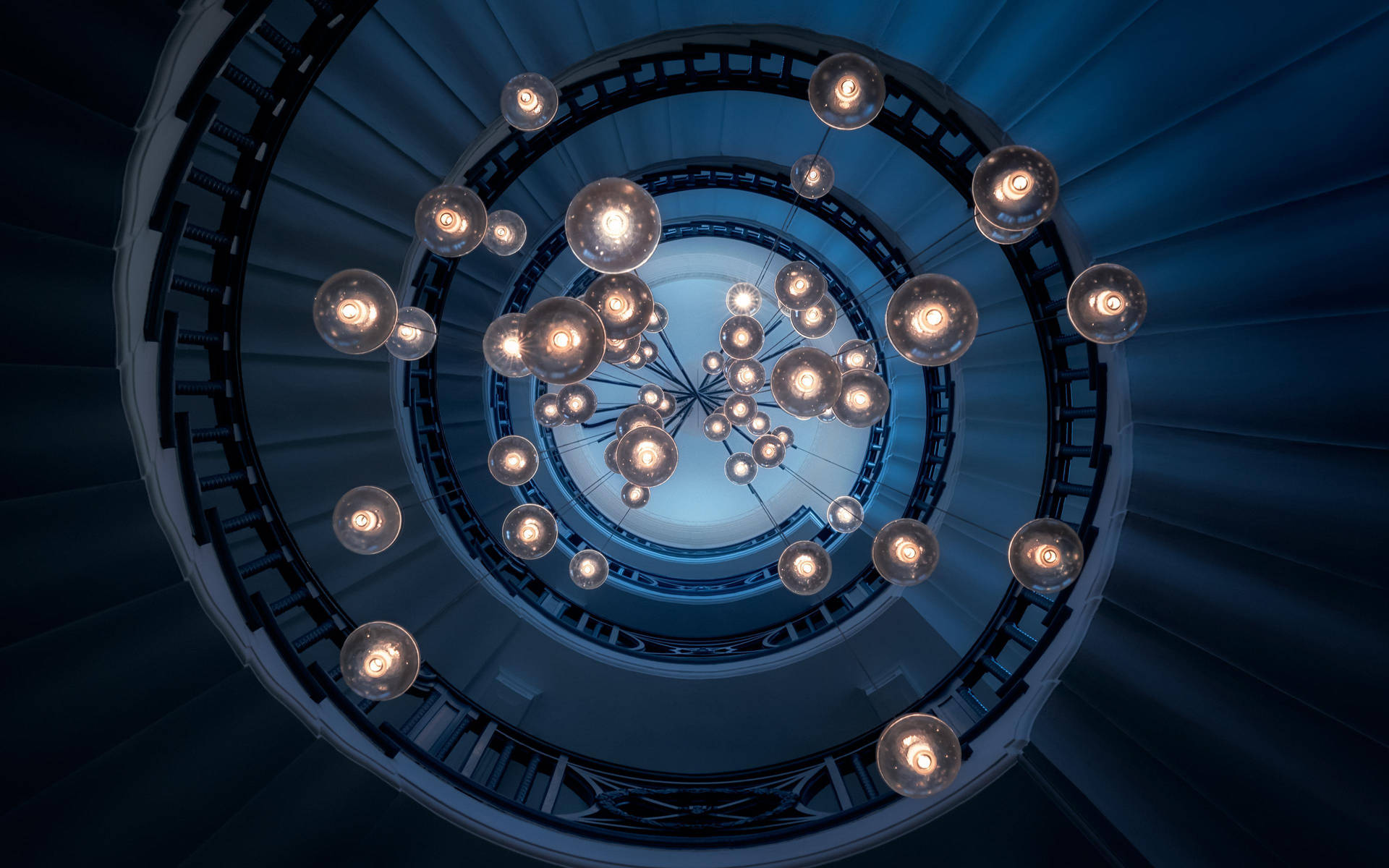Light Bulbs In Spiral Stairs Background