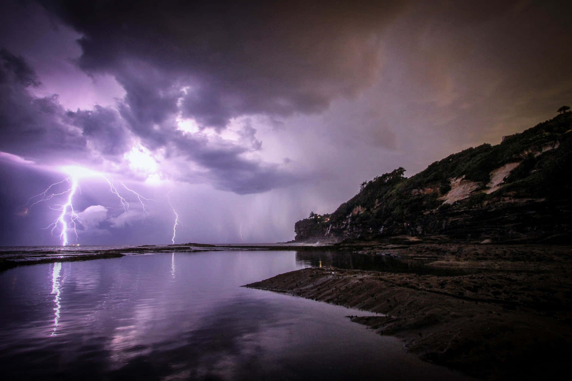 Light Purple Lightning Over Water Background