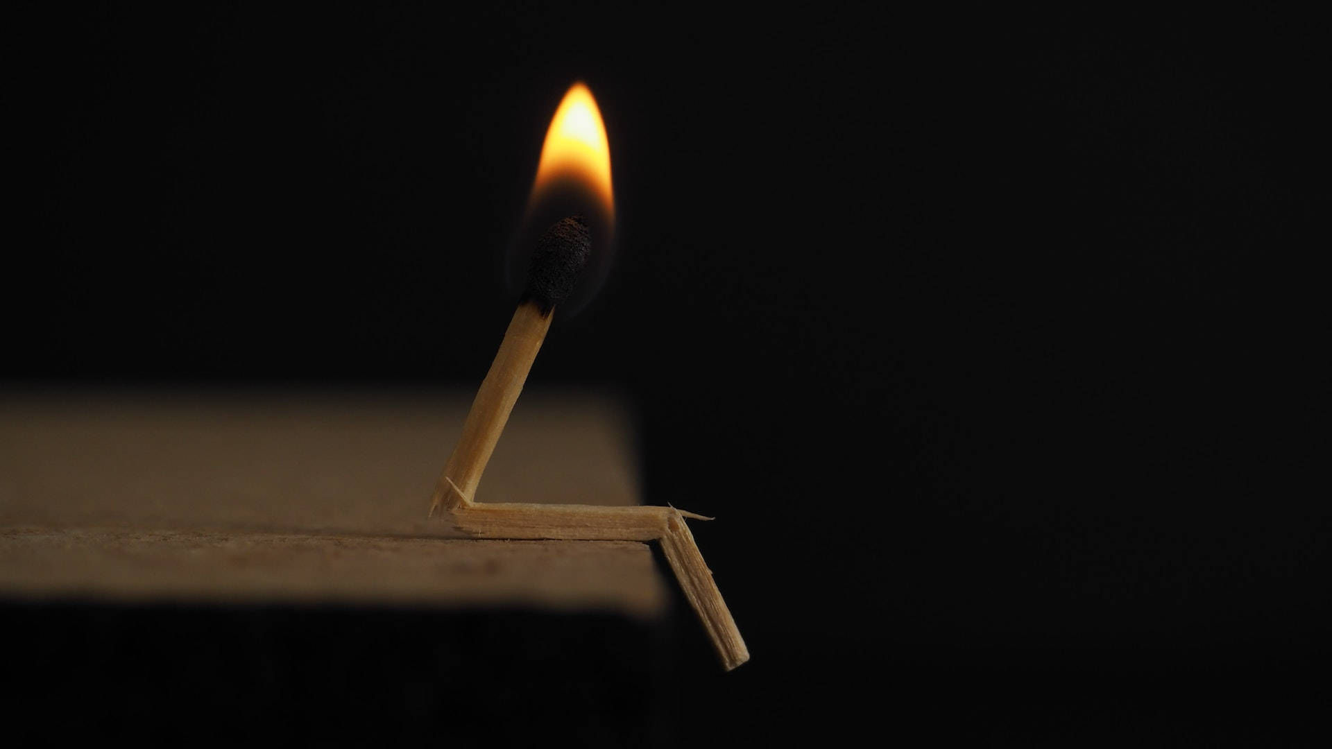 Lighted Matchstick On Black Pc Background