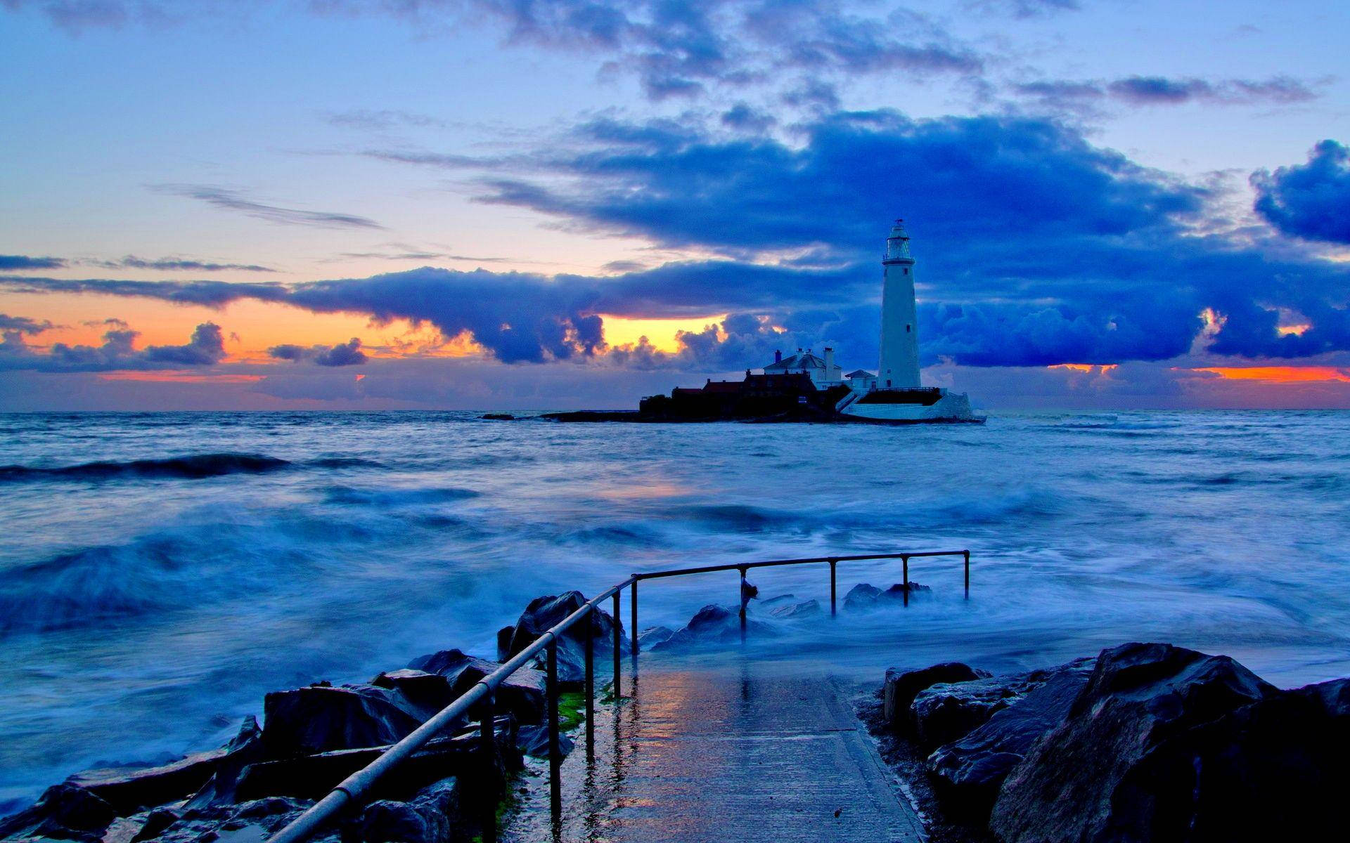 Lighthouse Amidst Water Background