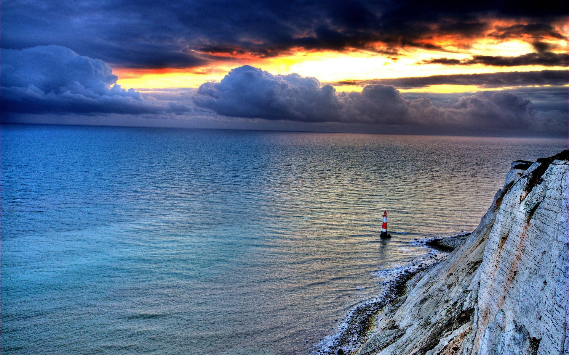 Lighthouse Below Cliffs Background