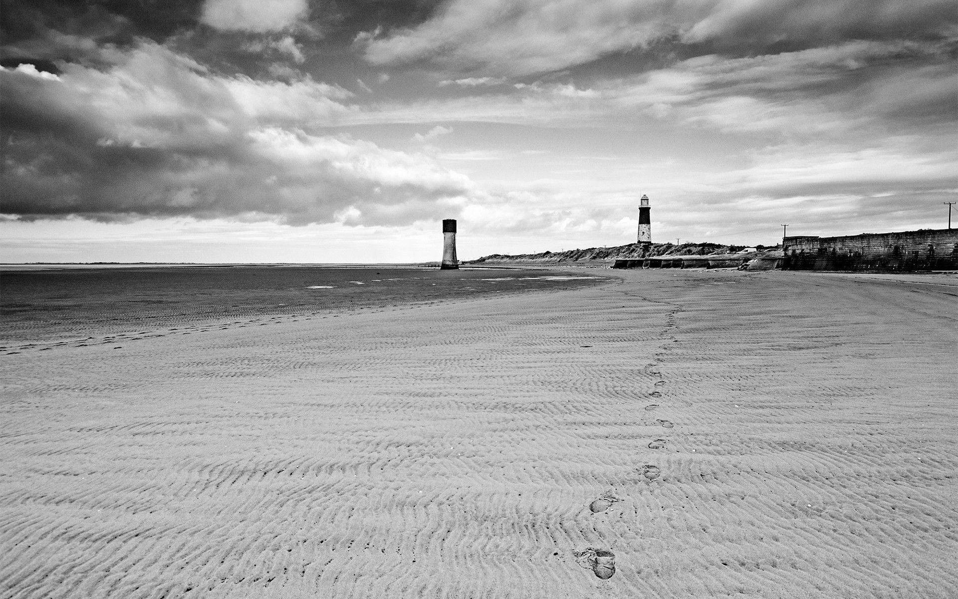 Lighthouse Footsteps In Sand Background