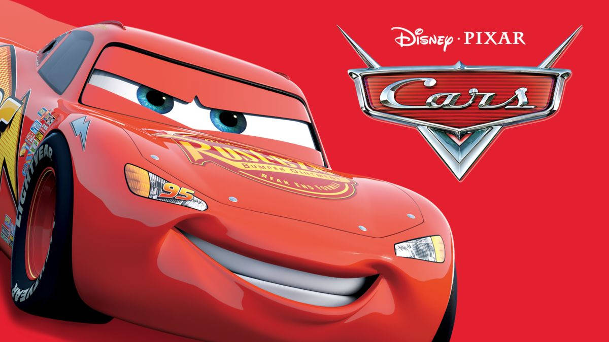 Lightning Mcqueen Grinning In Radiator Springs Background