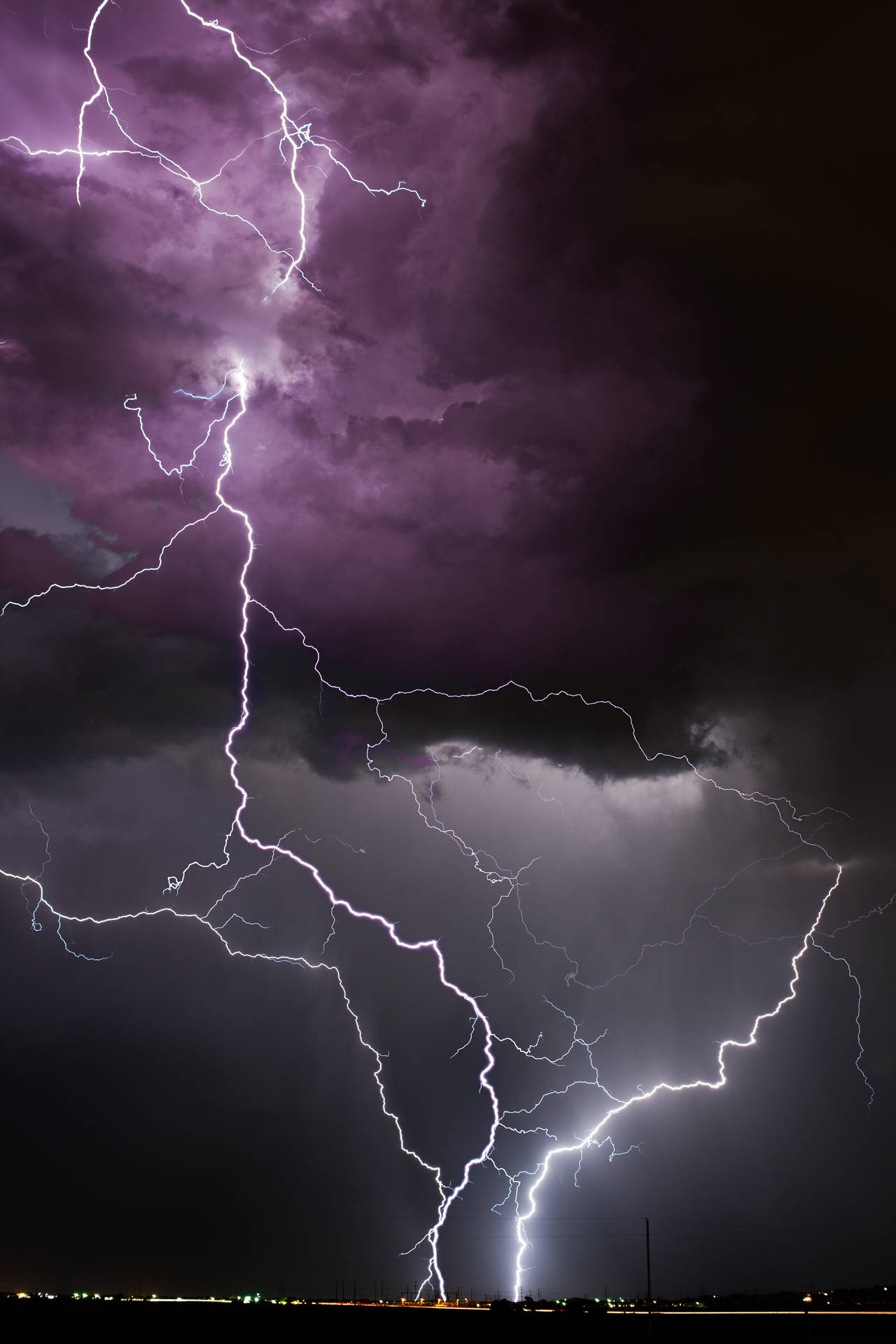 Lightning Strike In Purple And Black Background