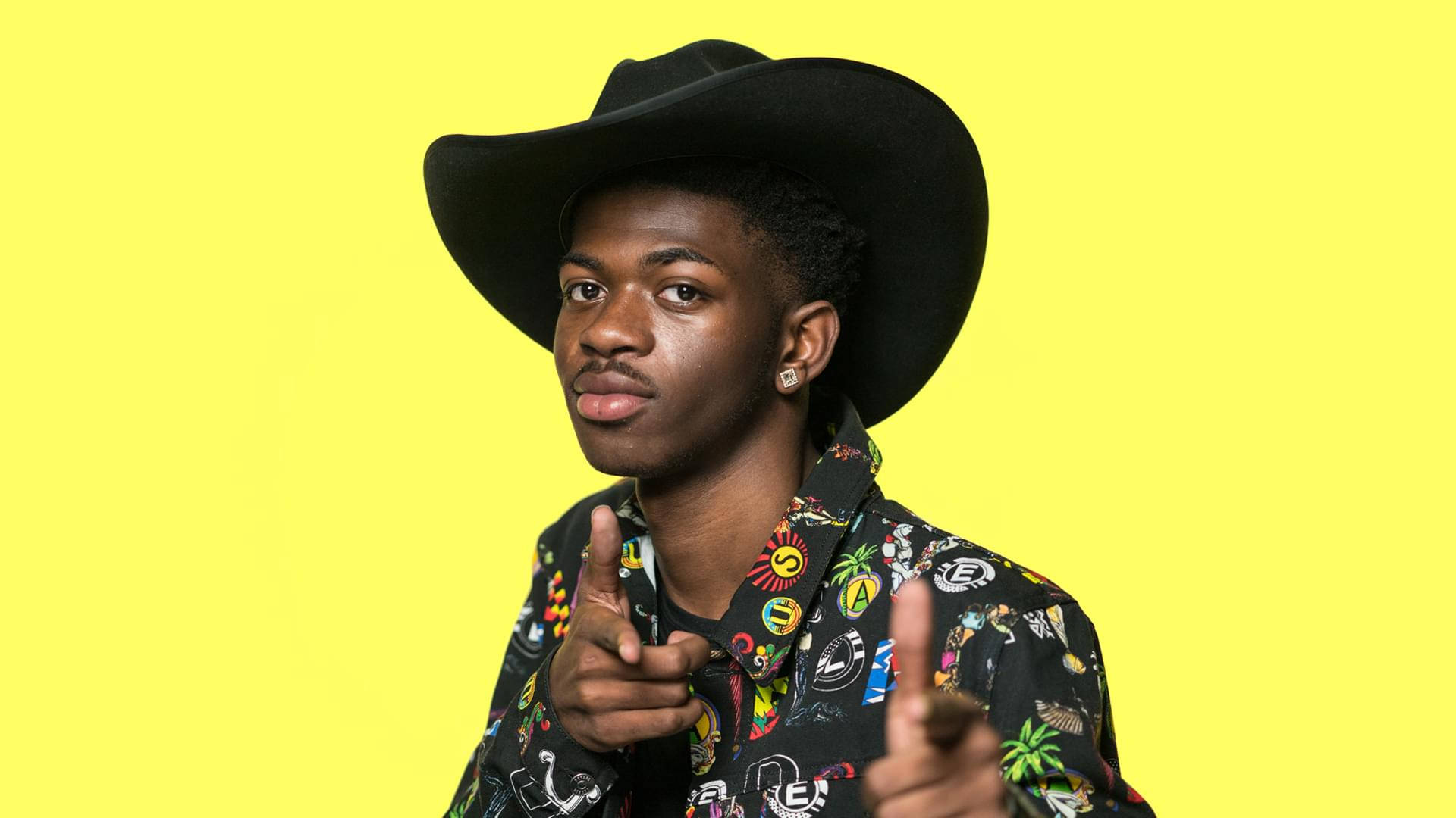 Lil Nas X In Yellow Background Background