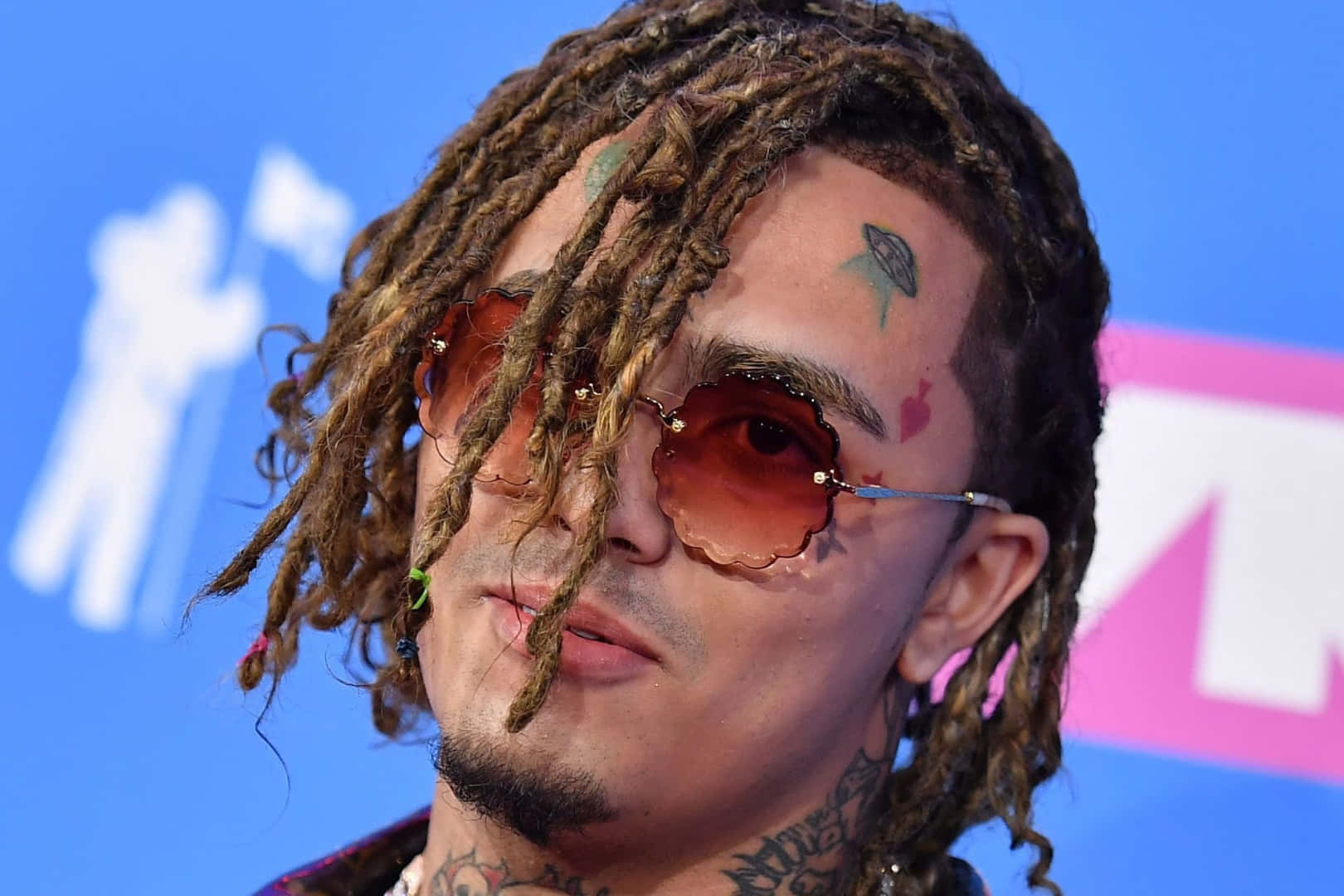 Lil Pump Rocking An Orange Hoodie Background