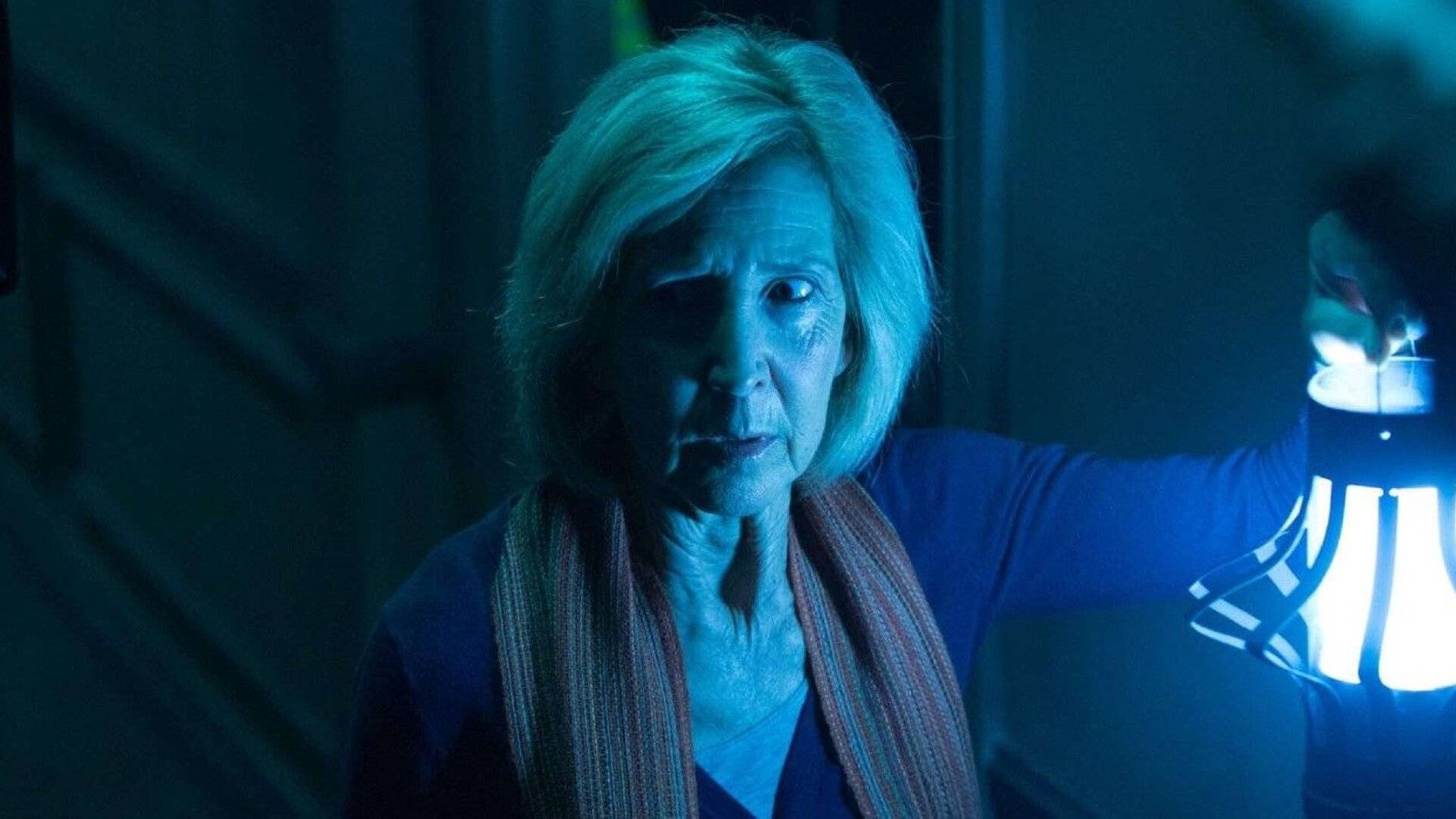 Lin Shaye In A Terrifying Movie Scene Background