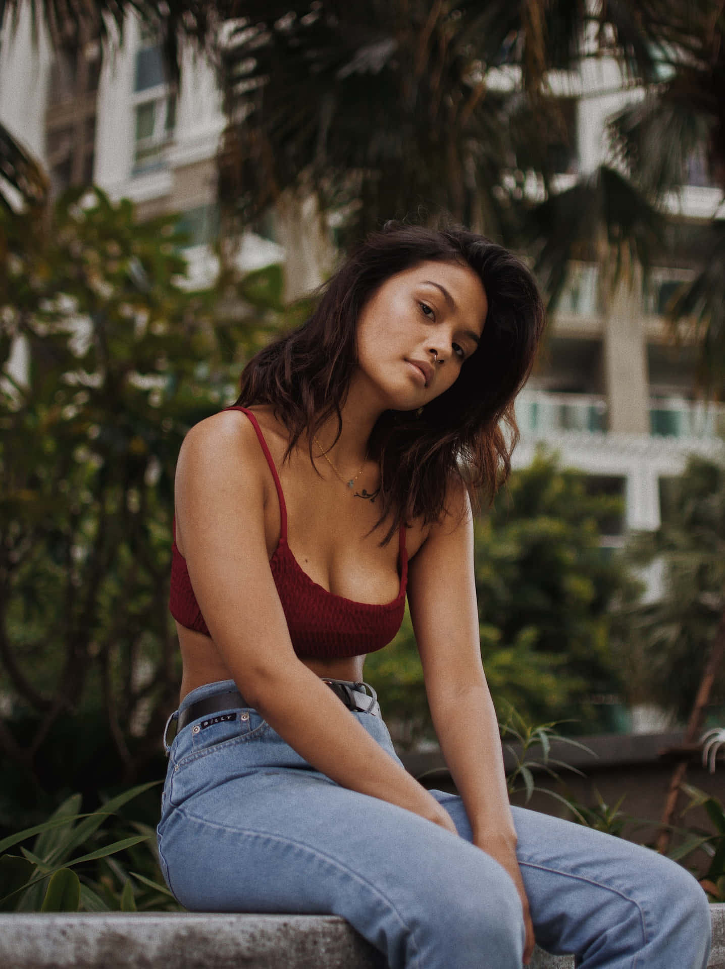 Linda Chica Sitting On A Bench Background