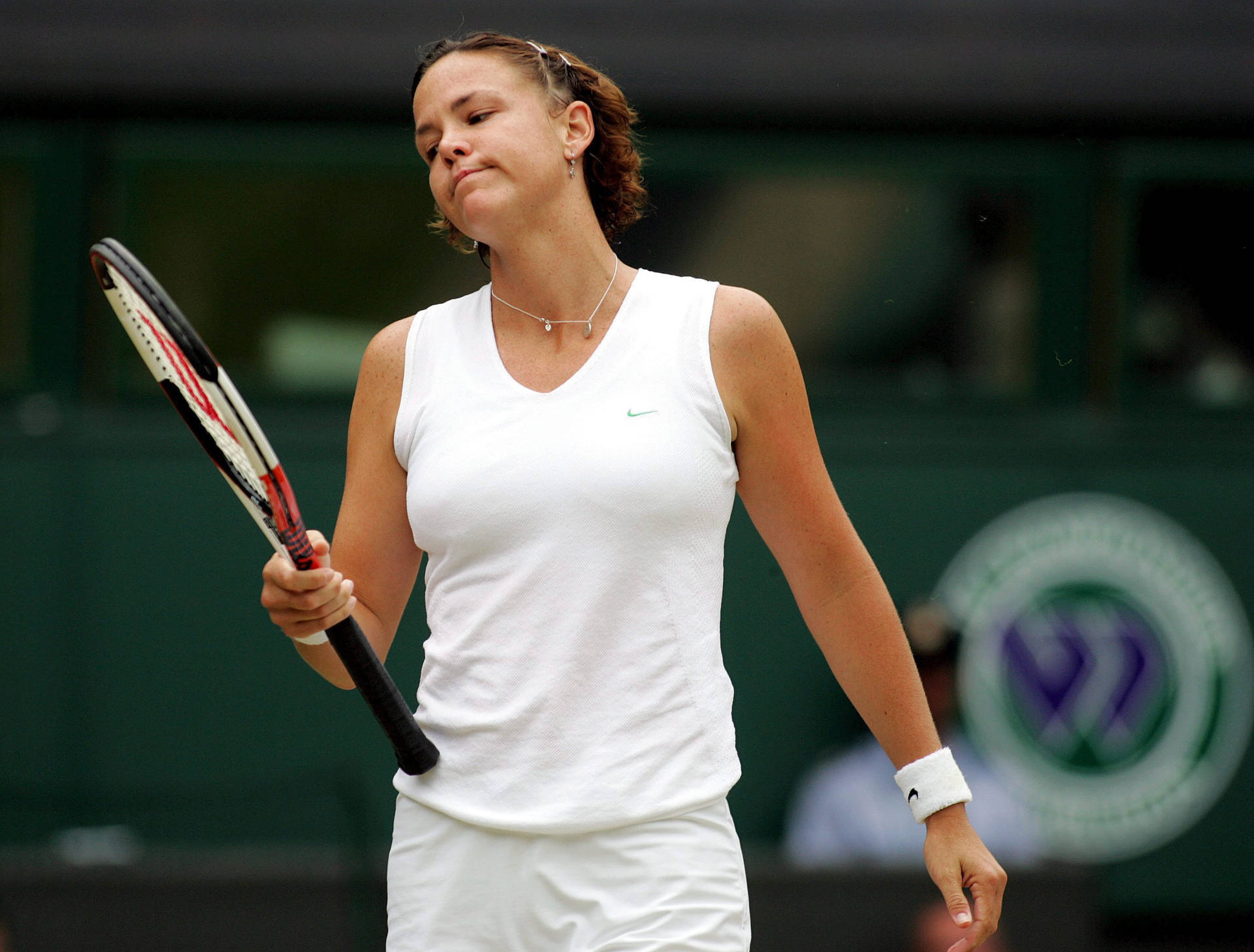 Lindsay Davenport In Action During A Tennis Match. Background