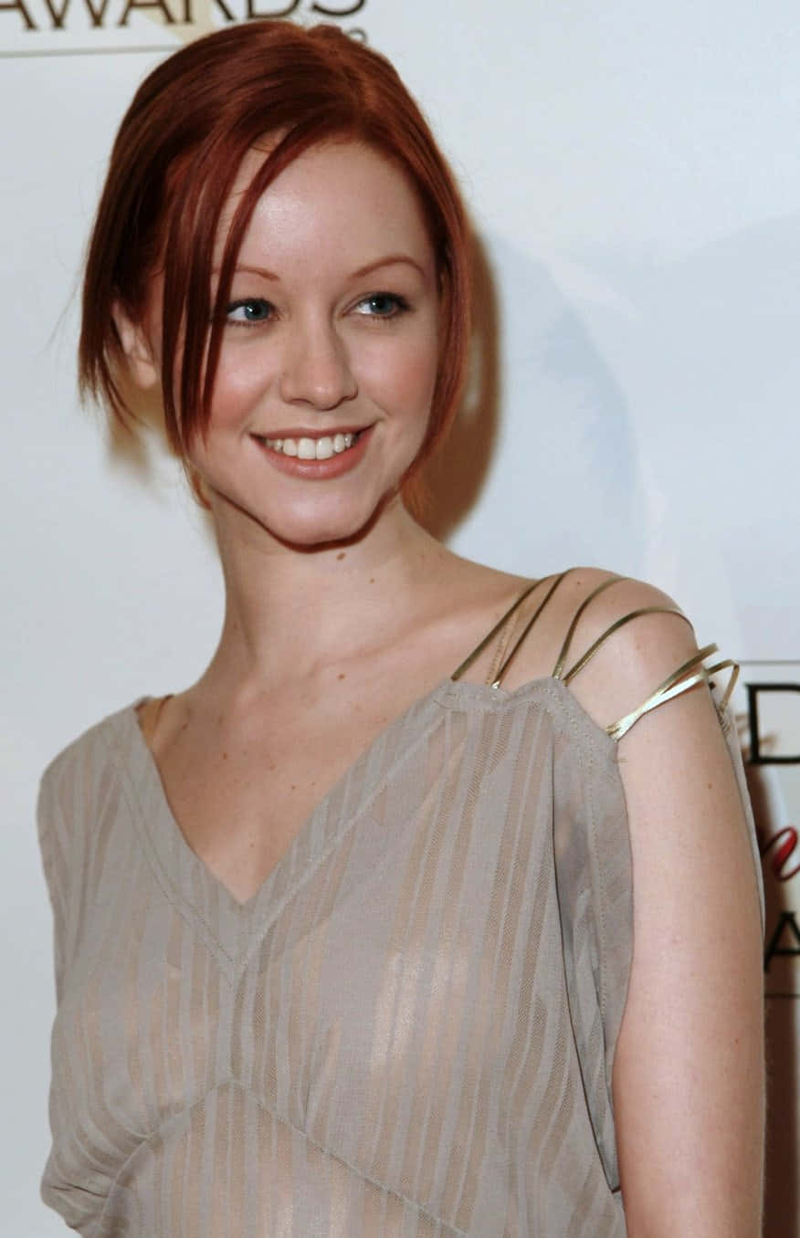 Lindy Booth Red Hair Smiling Background