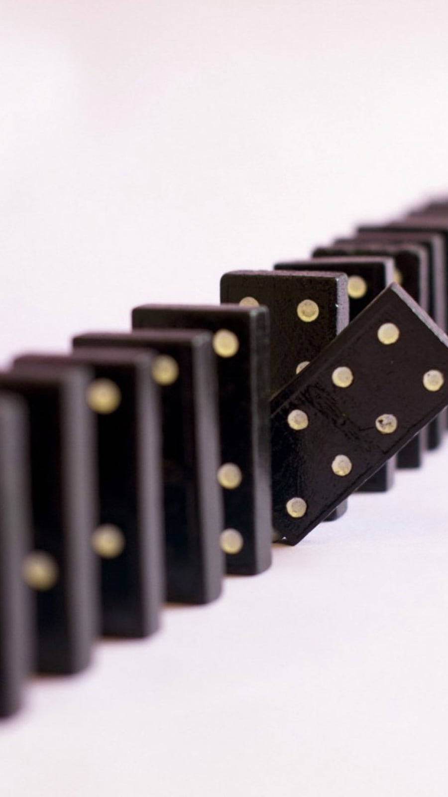 Line Of Dominos Ready For Action Background
