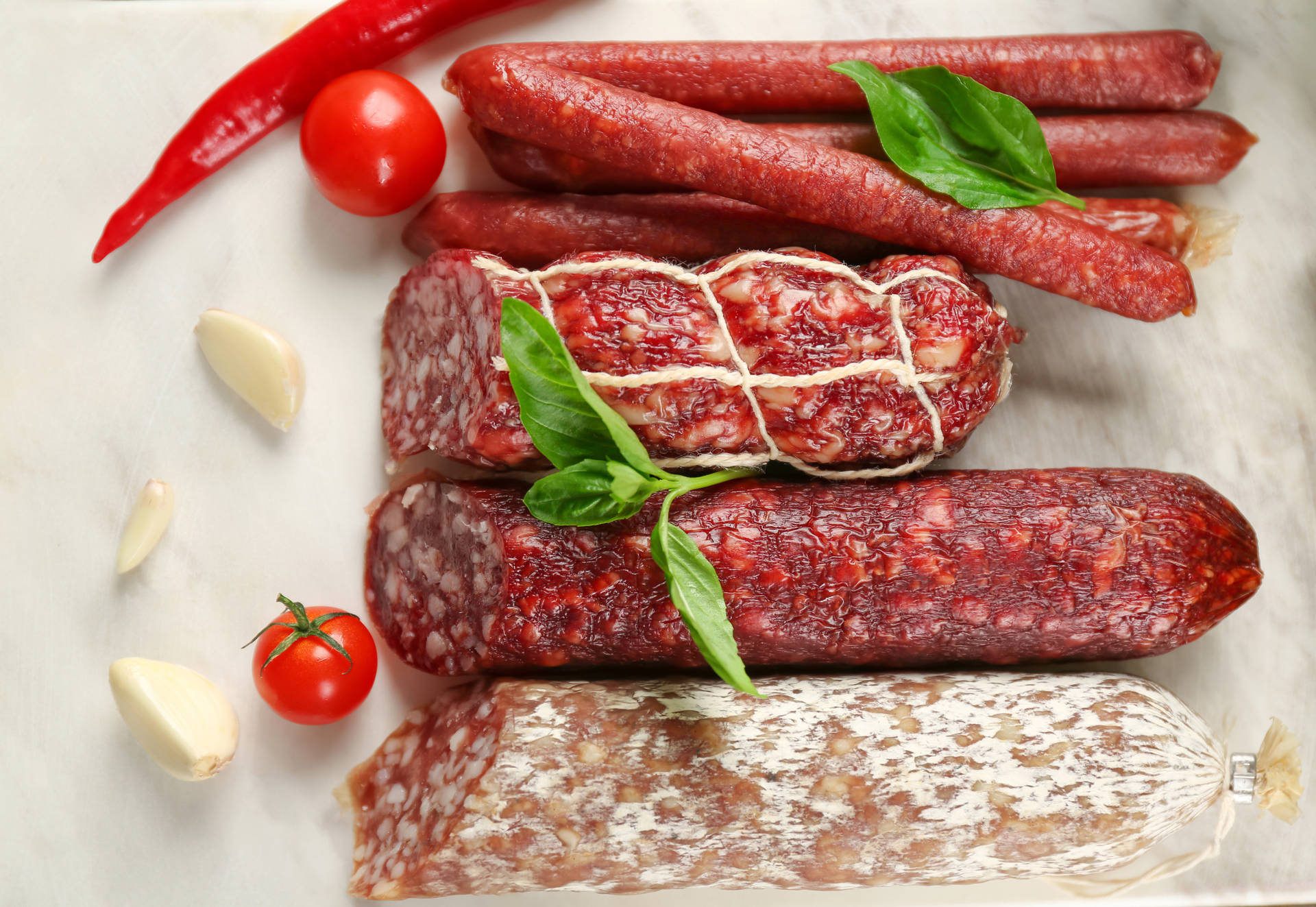 Lined Different Sausage Meat With Cherries Background