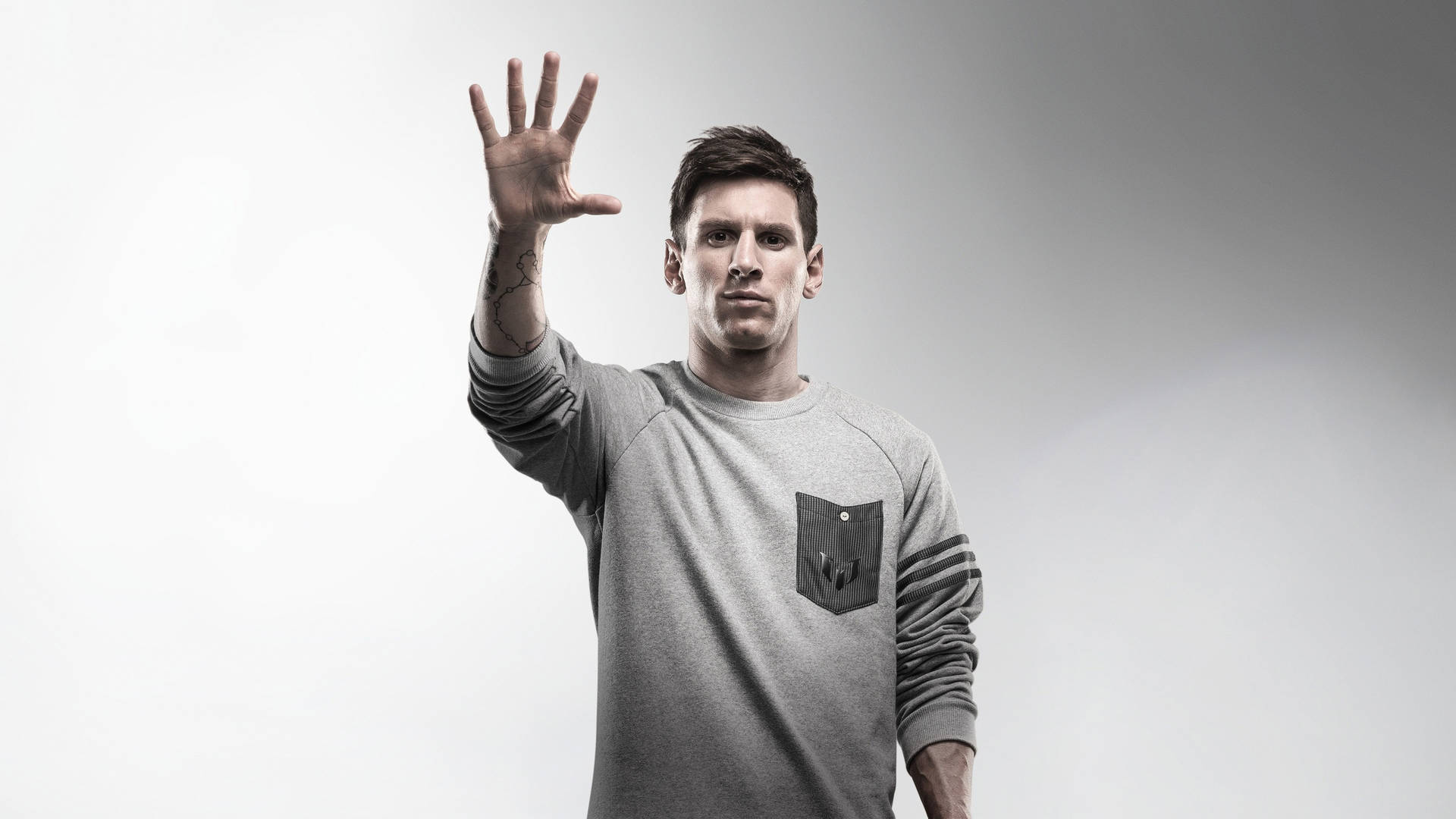 Lionel Messi With His Hand Out Background